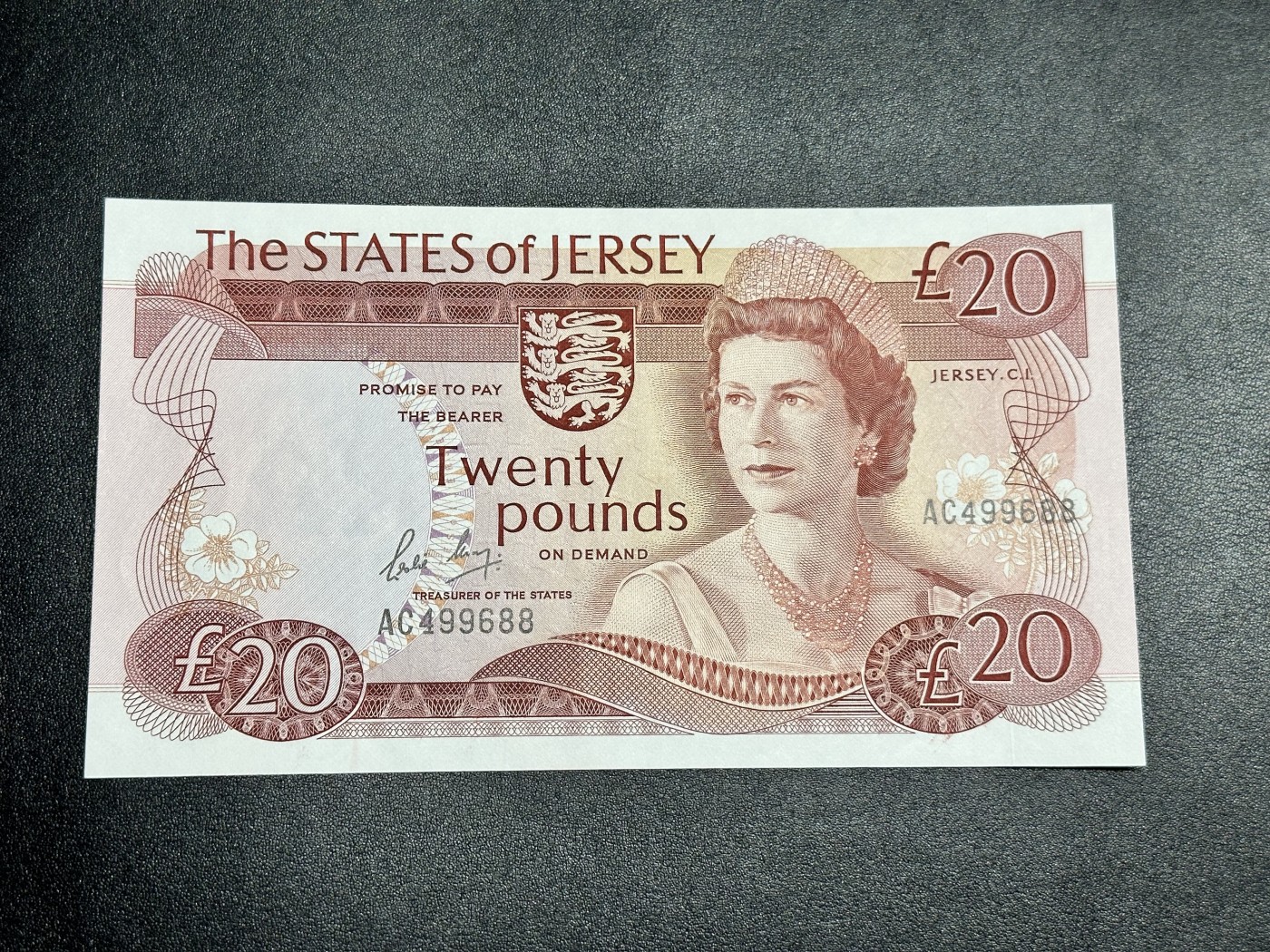 《外钞收藏家》第二百八十五期（连拍第二场）英国及英属专场 泽西岛1976年20镑，交流AC499688号券 全新