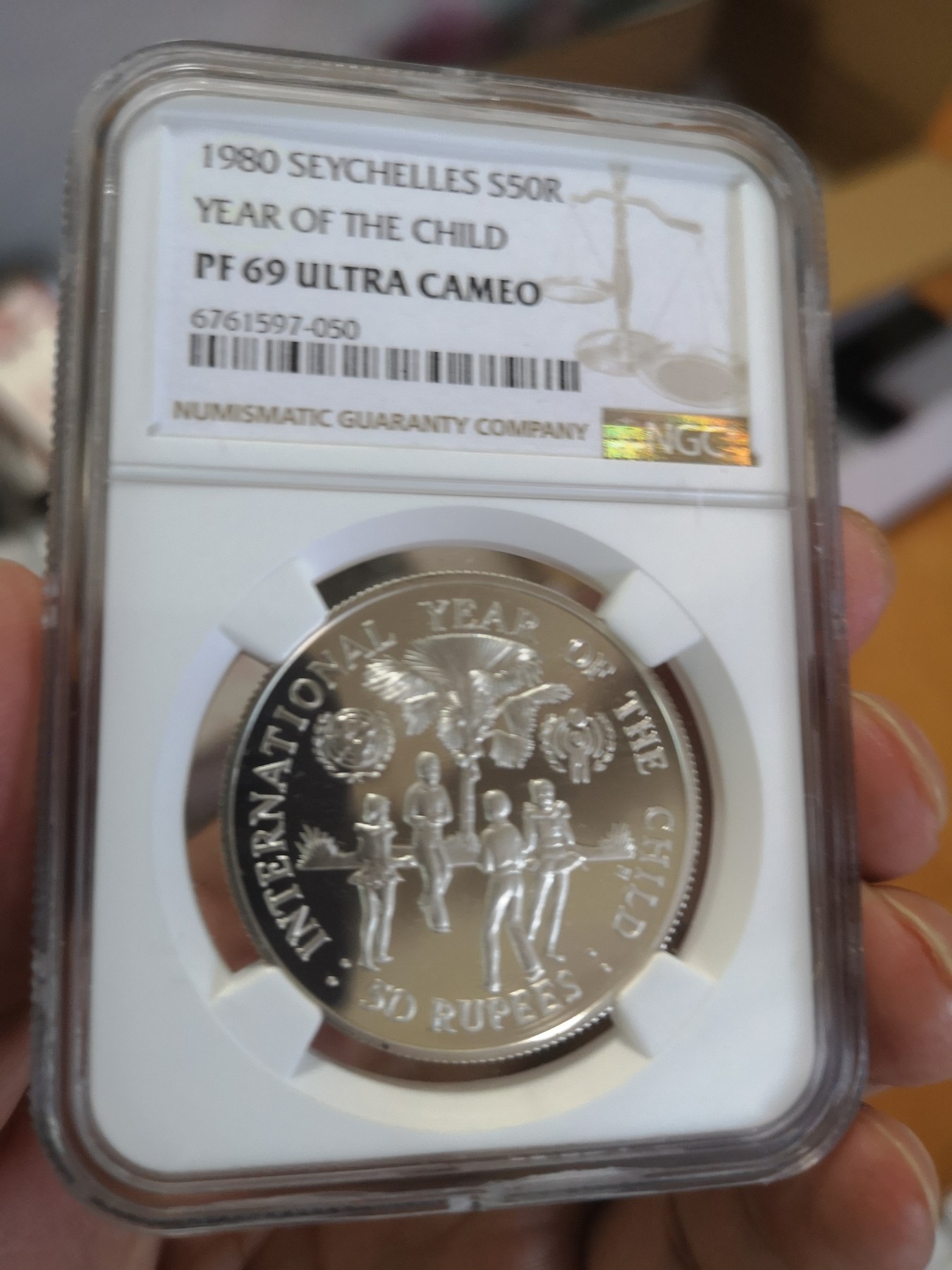 长老汇第17场儿童年评级币 1980塞舌尔儿童年50R精制银币，NGC PF69UC
