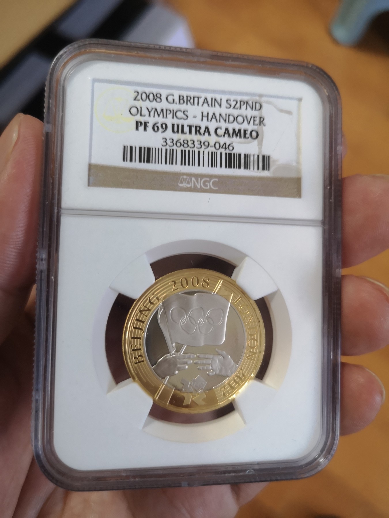 长老汇第17场儿童年评级币 2008英国奥运交接2英镑精制双色银币，NGC PF69UC