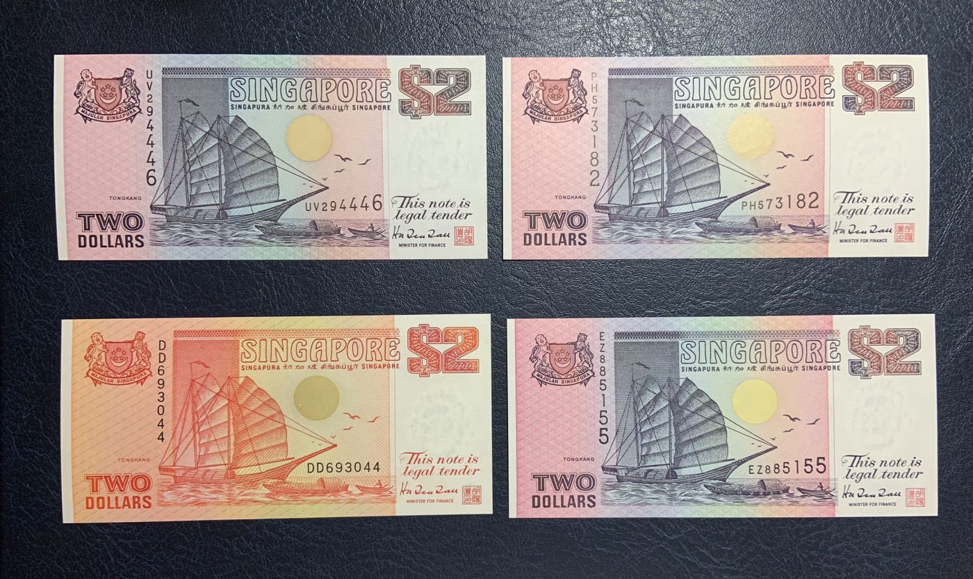 收藏联盟Quantum Auction 第275期拍卖  新加坡1990年2元(橙色初版)和1991年2元 品相UNC 其中一张有黄