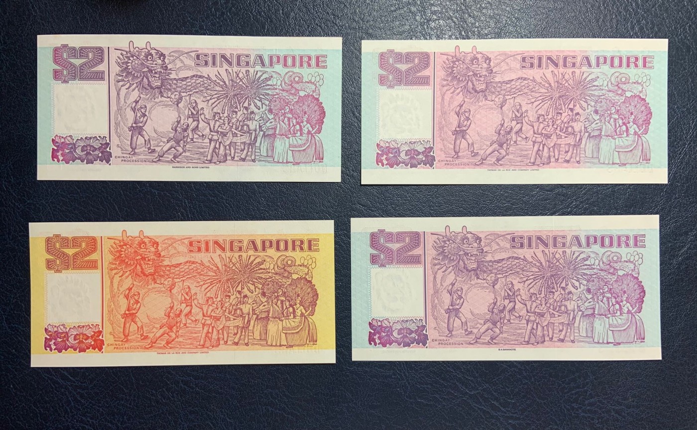 收藏联盟Quantum Auction 第275期拍卖  新加坡1990年2元(橙色初版)和1991年2元 品相UNC 其中一张有黄