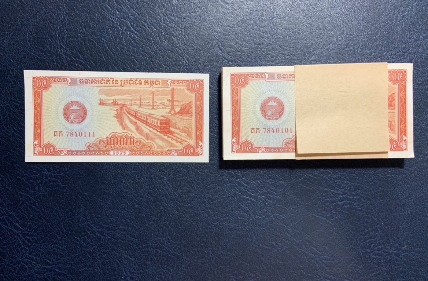 收藏联盟Quantum Auction 第275期拍卖  柬埔寨1979年0.1和0.5瑞尔100连号整刀 品相UNC- 