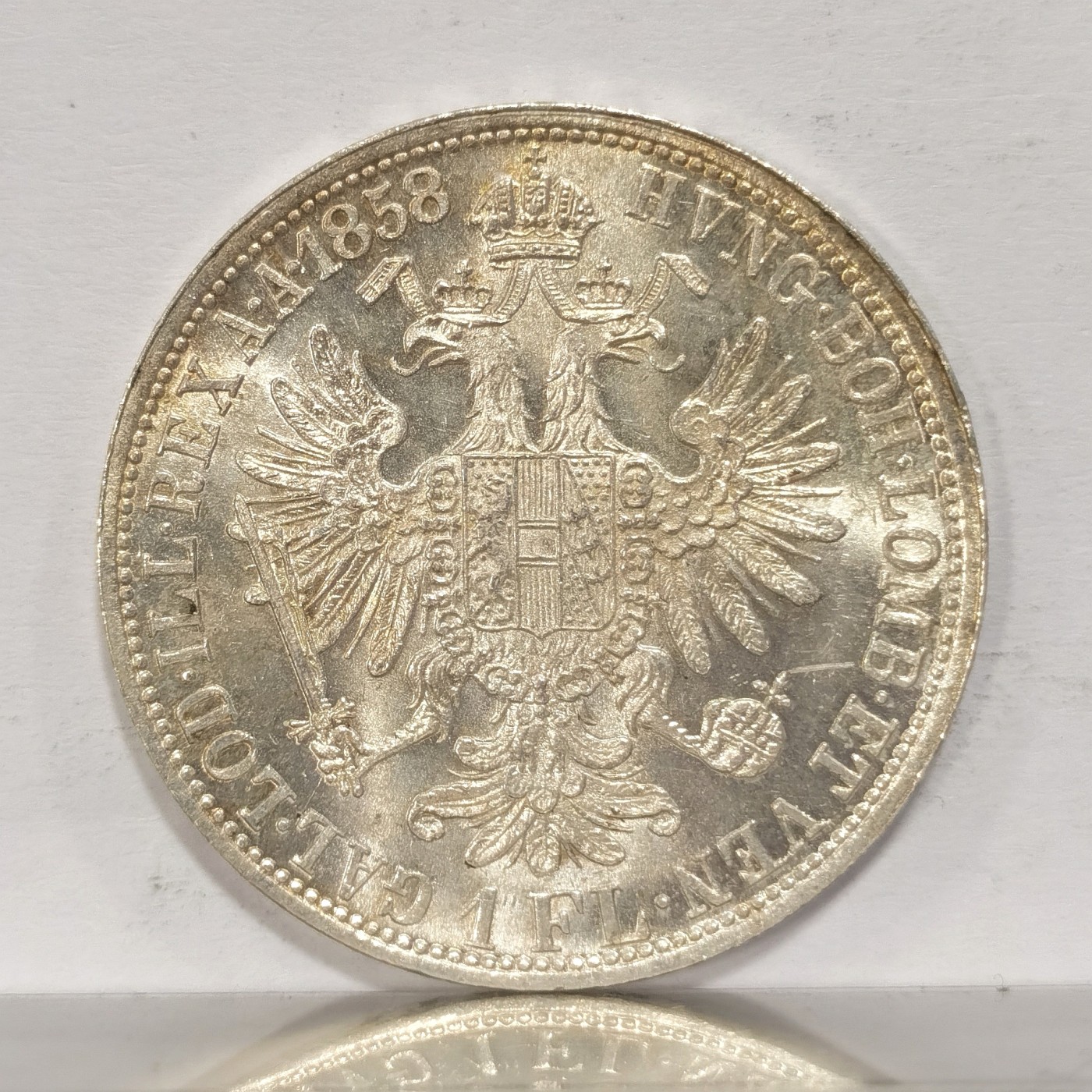 博洋堂世界钱币拍卖第036期（全场包邮） 奥地利帝国1858年1弗罗林银币，BU品相，转光强烈，打制深峻，经典双头鹰威风凛凛