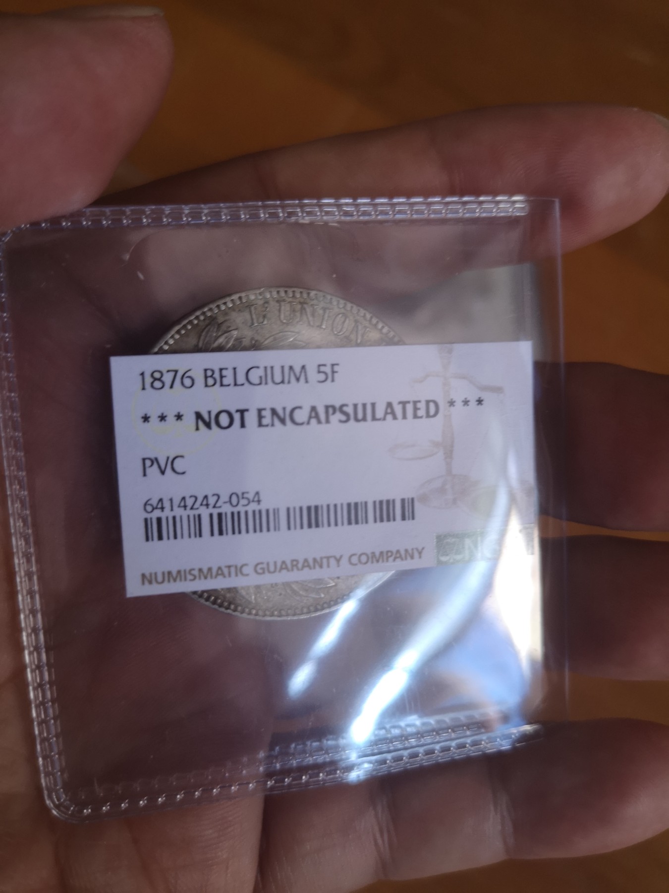 长老汇第24场老银币拍卖 1876比利时利奥波德二世5法郎大银币，未流通品相，NGC判PVC污染