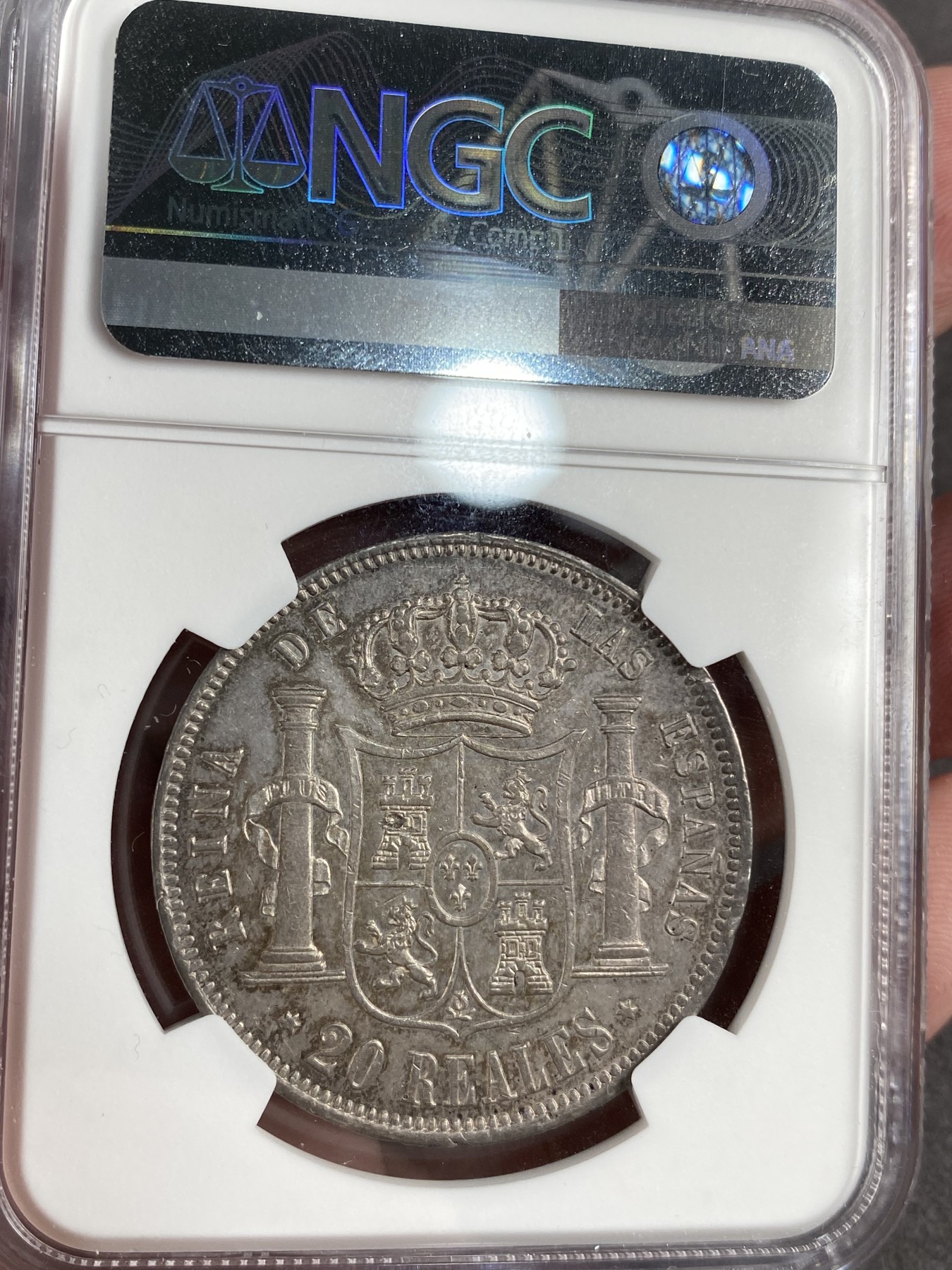 万国钱币拍卖第013期（视频直播专场） NGC AU53 1858年西班牙伊莎贝拉20里拉双柱银币，原味五彩。