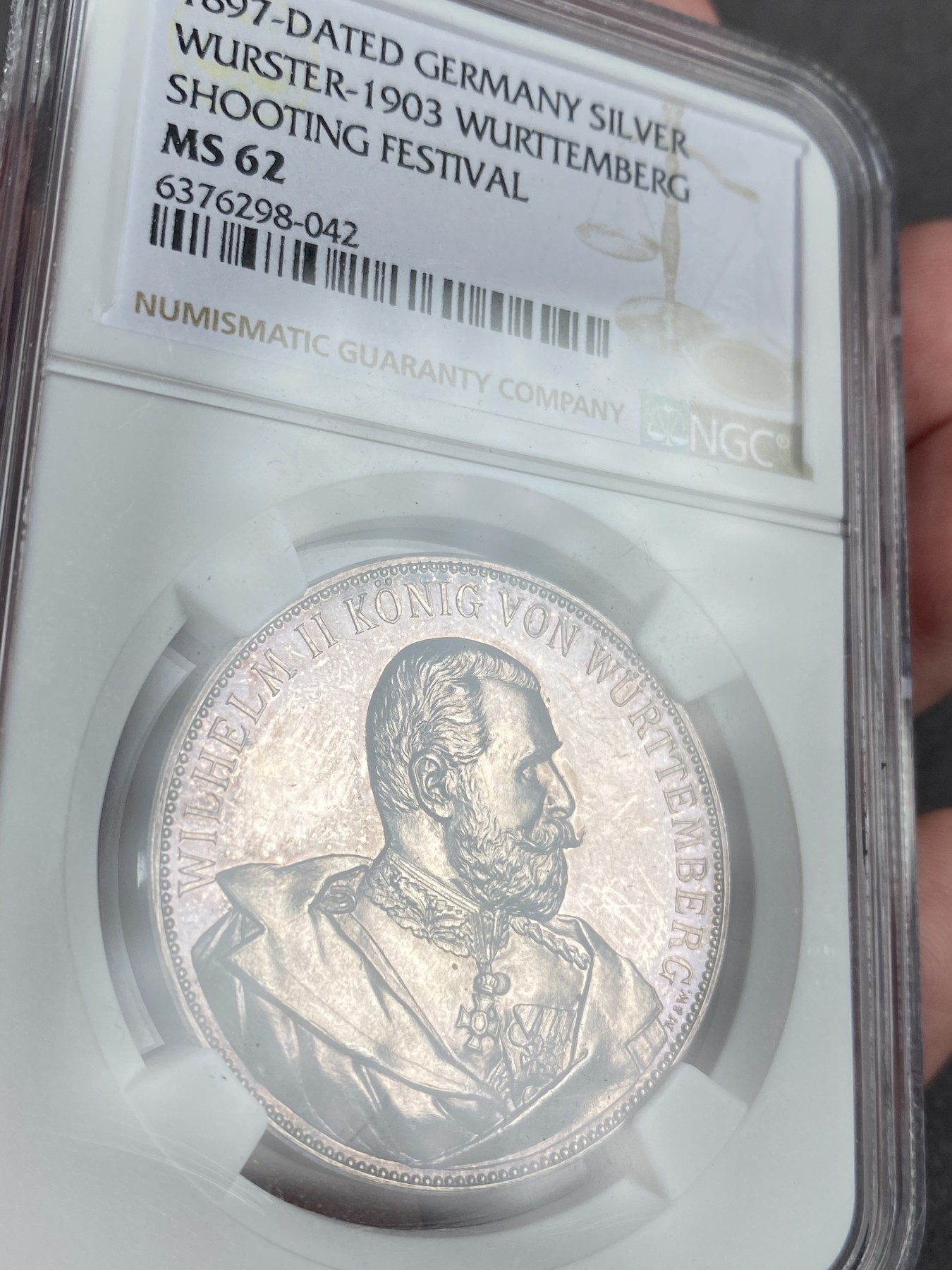 万国钱币拍卖第013期（视频直播专场） NGC MS62 1897年德国符腾堡第十六届射击节纪念银章 极其精美的狮鹿纹章 少见品种 偶出一个也带有吊环 没有吊环的面世的大概就这一个吧