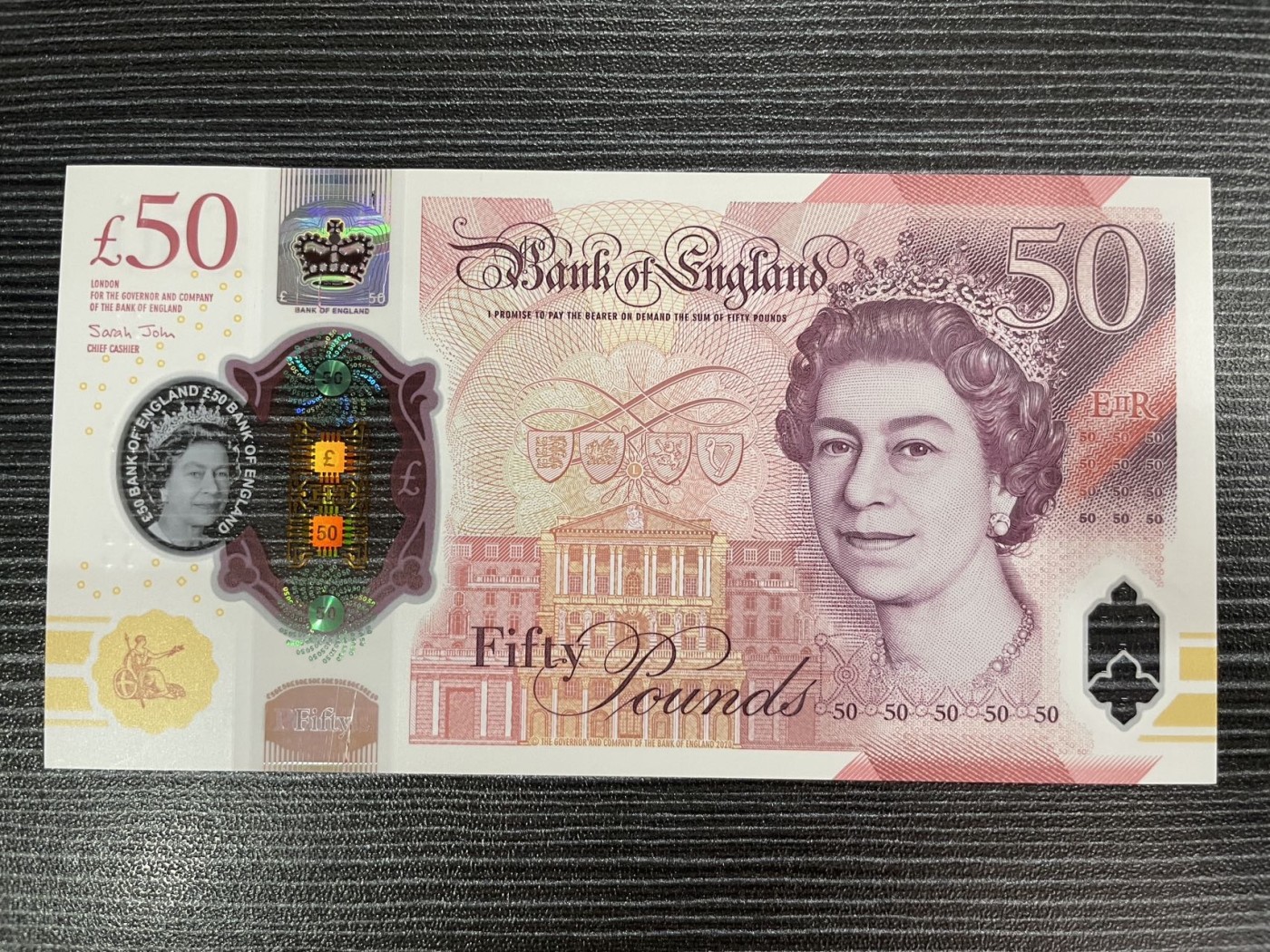 【浩洋钞市】纸钞拍卖第六期—周日下午三点 全新英国50镑塑料钞首发冠A01（窗口极轻微刮痕）