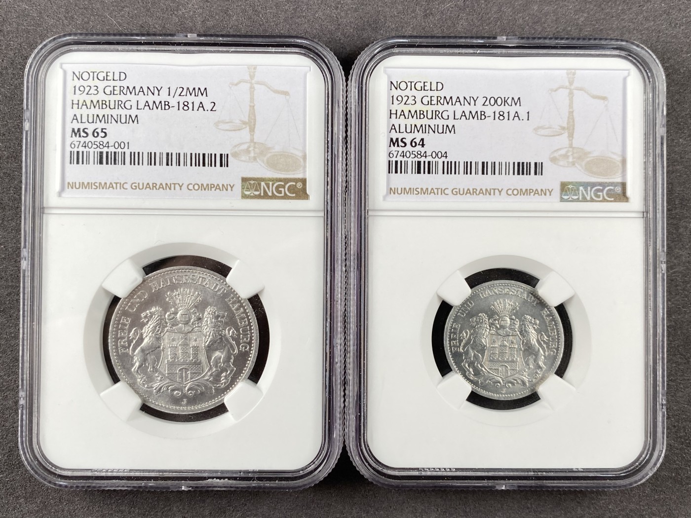 万国钱币拍卖第013期（视频直播专场） NGC MS65/64 一组两枚德国紧急状态货币，1923年汉堡50万马克1/2Million Mark（1/2MM）&20万马克（200KM），其中20万马克为亚军分，更高分仅一枚，品相一步到位，非常值得收藏的一组汉堡德紧。
