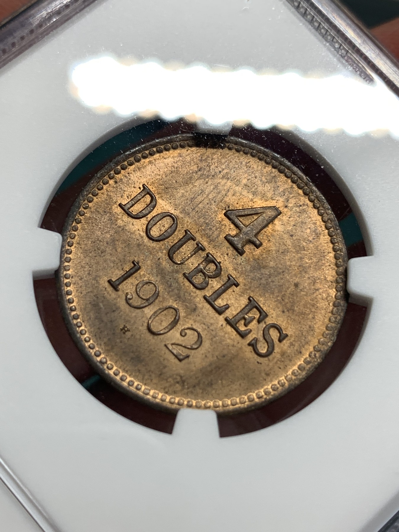 《竞宝斋》第186场-周日，周一 2场 (全场包邮) NGC-MS64RB 亚军分 1902年英属根西岛4道布铜币，三狮正面像，面部细节出色，铜光犹存，状态出