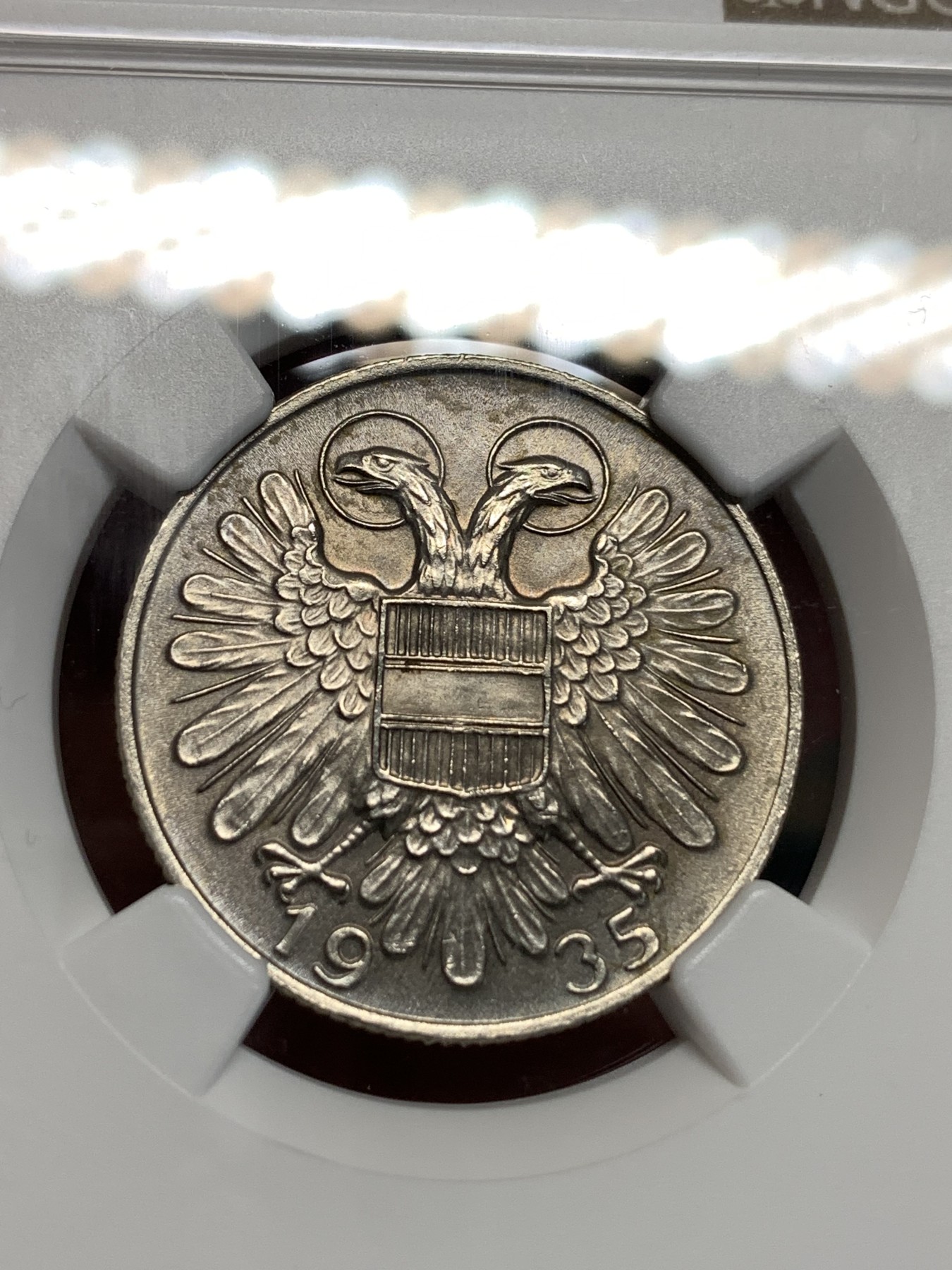 《竞宝斋》第186场-周日，周一 2场 (全场包邮) NGC-MS63 奥地利1935年 1先令银币，图案艺术性高，无可挑剔的品相