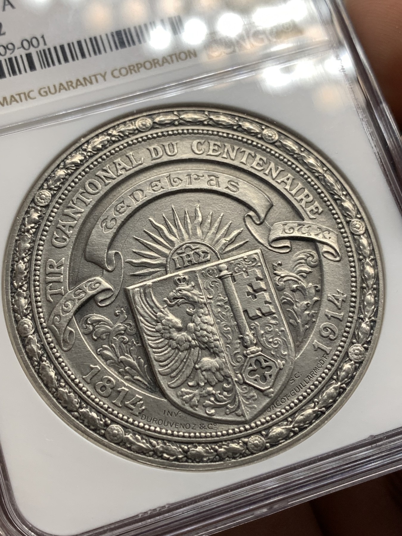 《竞宝斋》第186场-周日，周一 2场 (全场包邮) NGC-MS62 瑞士 1914年 日内瓦射击节 45mm 大银章 设计漂亮 细节满满