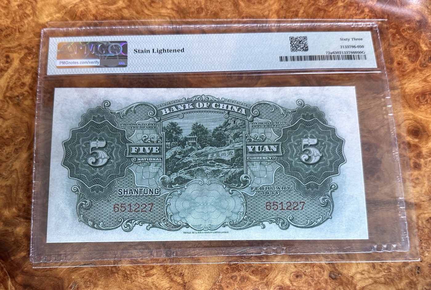 Chase Auction 第23期 - - 外钞、民国钞和人民币混合场！ 1934年民国中国银行5元，山东，万古长青牌坊，PMG63，更高分只有25枚，有背标，轻度除锈！
