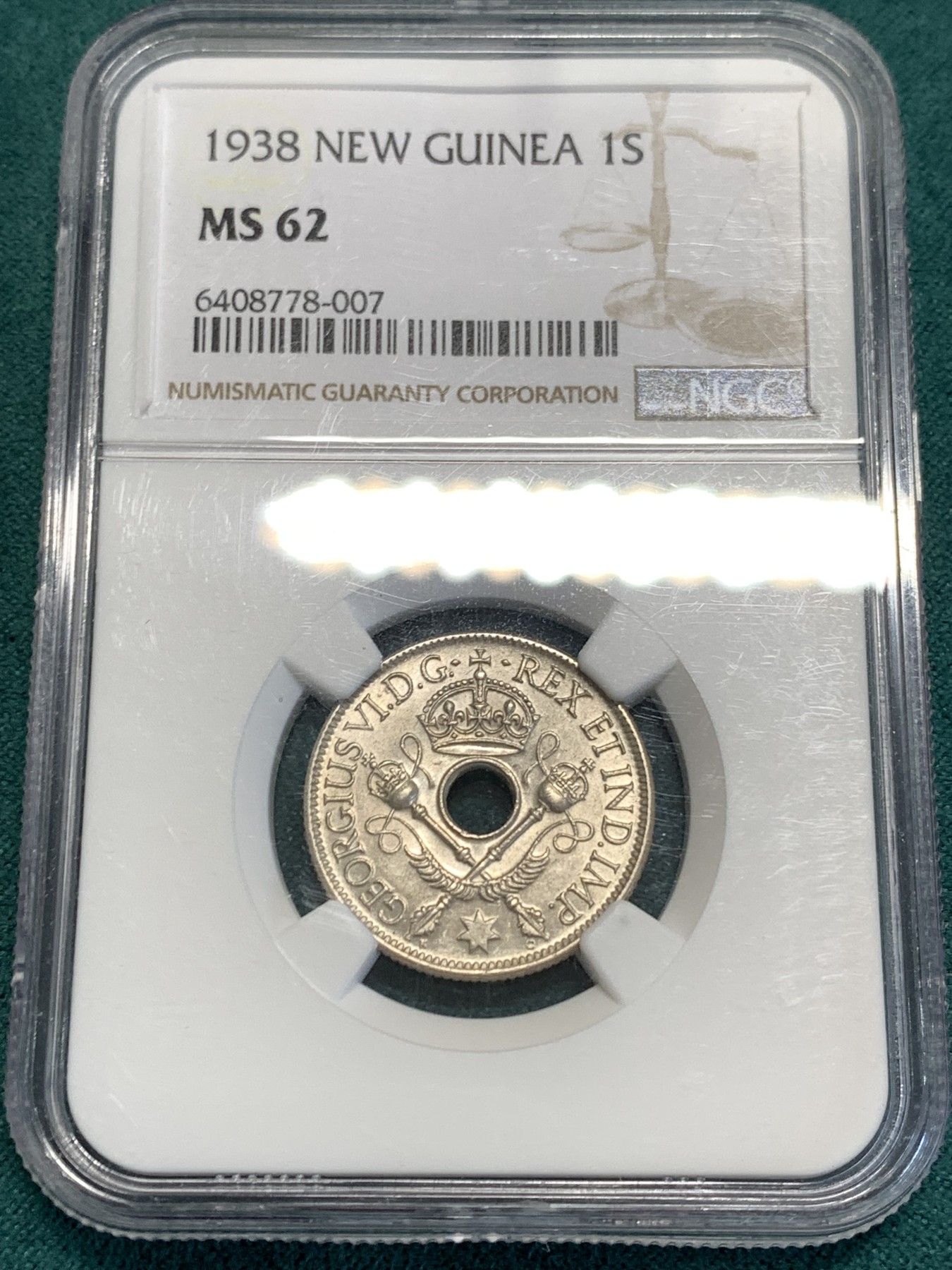 《竞宝斋》第187场-周日，周一 2场 (全场包邮) NGC-MS62  新几内亚 1938年 乔治六世一先令银币，转光良好，设计精美，融合英伦皇家气派与新几内亚土著风情