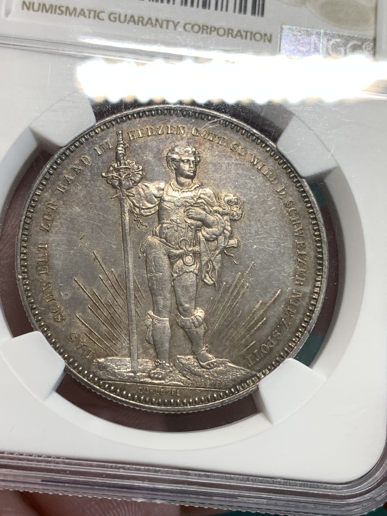 《竞宝斋》第187场-周日，周一 2场 (全场包邮) NGC-UNC 瑞士1879年 巴塞尔射击节5法郎银币   淡彩包浆 细节清晰