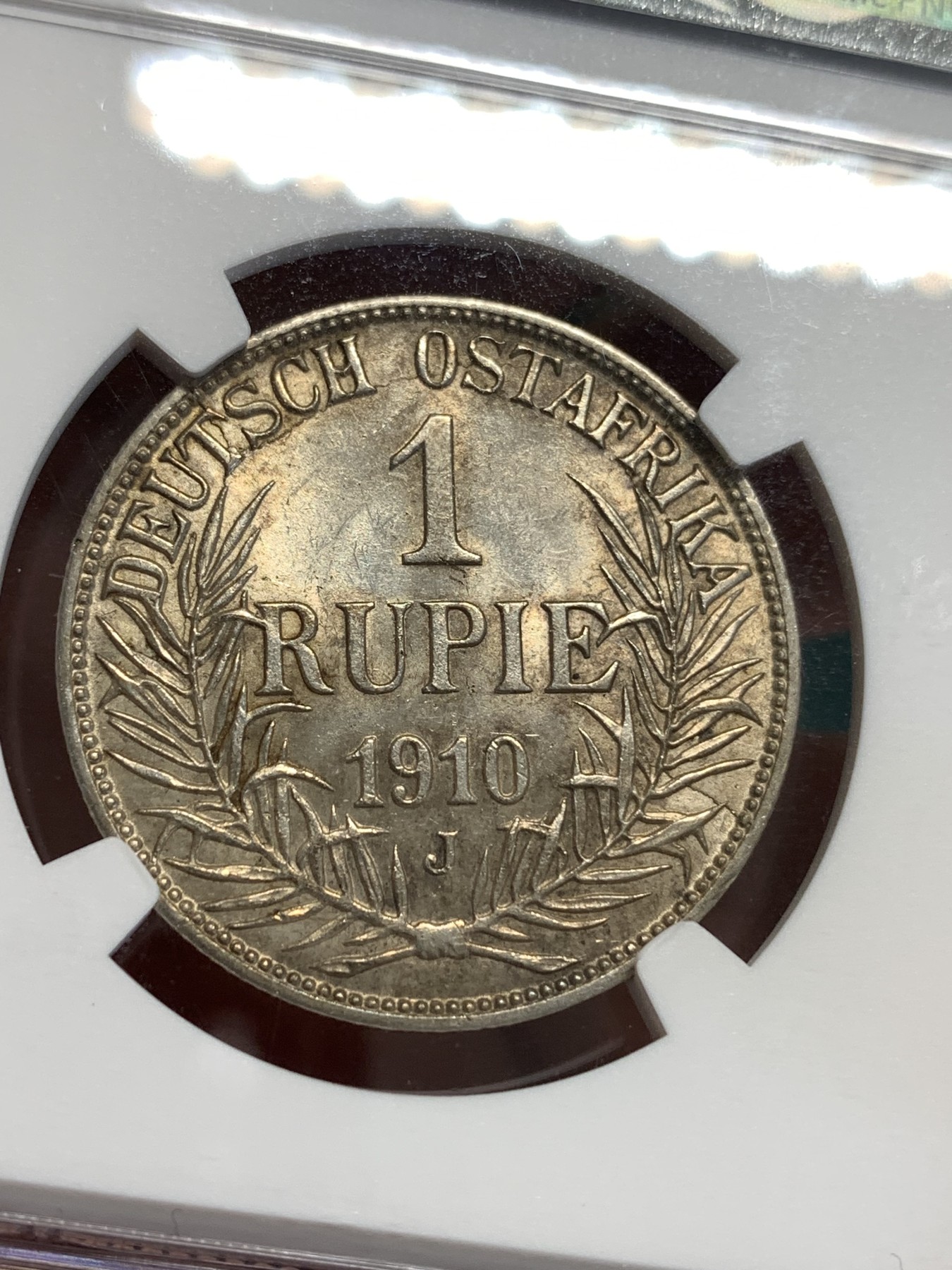 《竞宝斋》第187场-周日，周一 2场 (全场包邮) NGC UNC 东非1卢比银币 较少年份 干环境包浆 这品种好品少