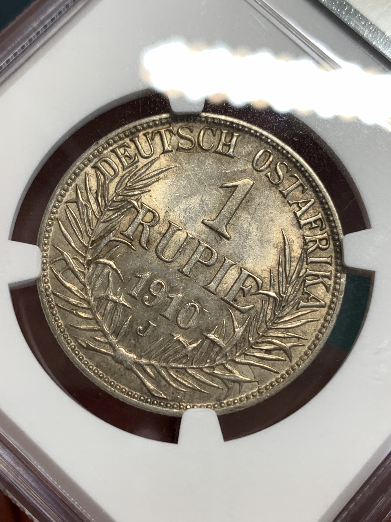 《竞宝斋》第187场-周日，周一 2场 (全场包邮) NGC UNC 东非1卢比银币 较少年份 干环境包浆 这品种好品少