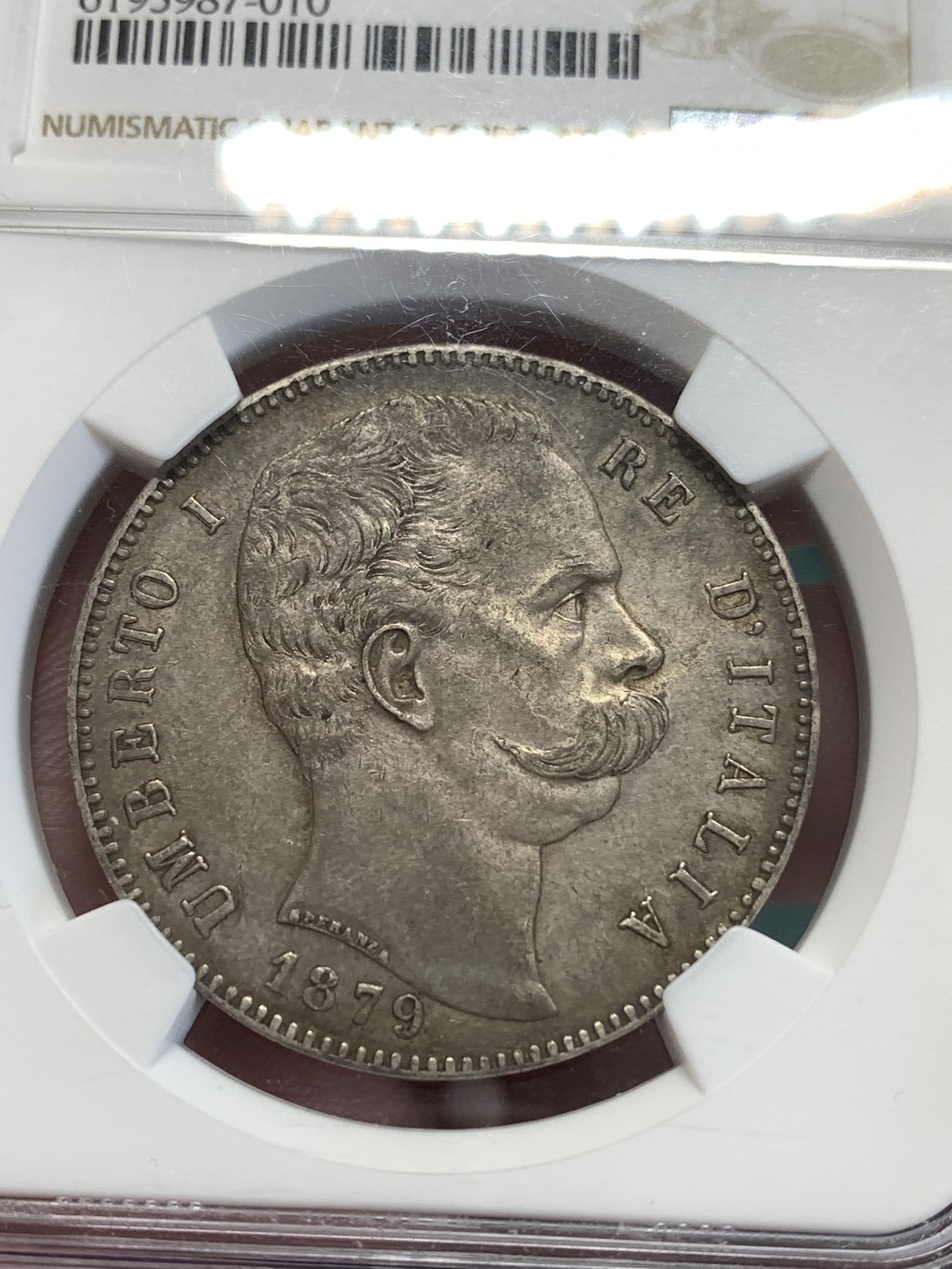 《竞宝斋》第188场-周日，周一 2场 (全场包邮) NGC AU58 意大利1879年翁贝托一世5里拉银币，极美包浆。细节精细，两只眼睛炯炯有神