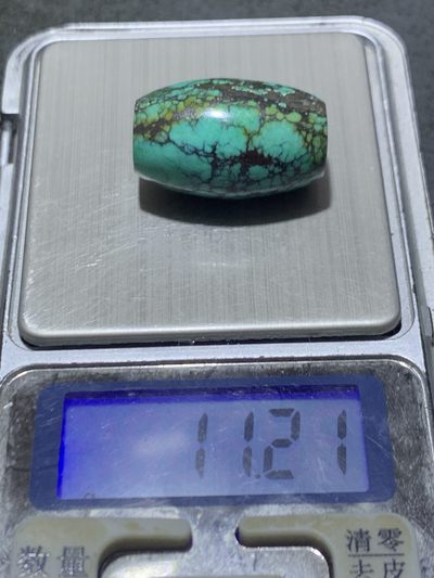 精美十堰高瓷蓝网花松石桶珠一颗 精美十堰高瓷蓝网花松石桶珠一颗