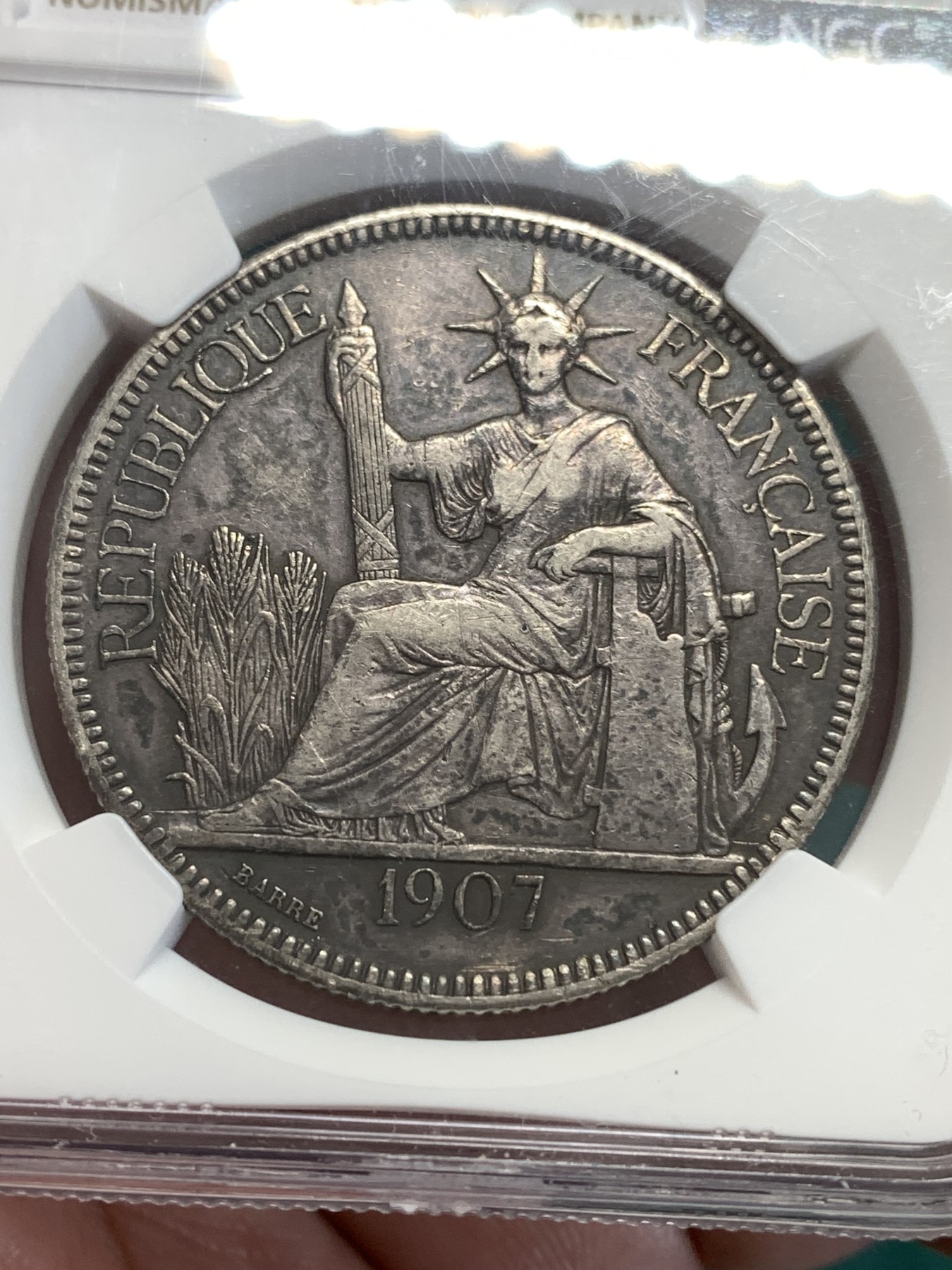 《竞宝斋》第189场-周日，周一 2场 (全场包邮) NGC XF45 法属印支1907坐洋一元银币