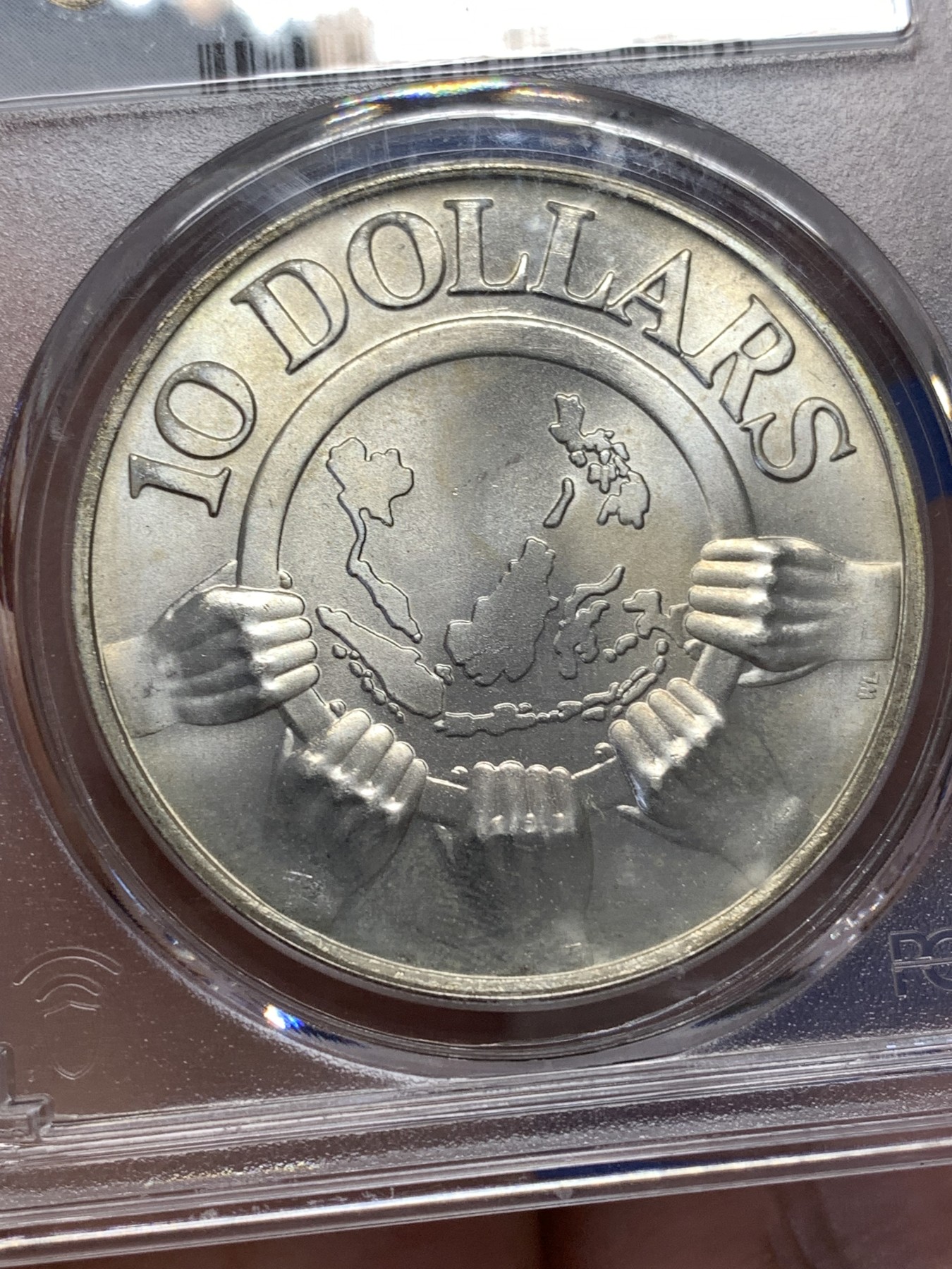 《竞宝斋》第189场-周日，周一 2场 (全场包邮) PCGS MS66 新加坡1977年东盟10周年10元大银币 旋转光