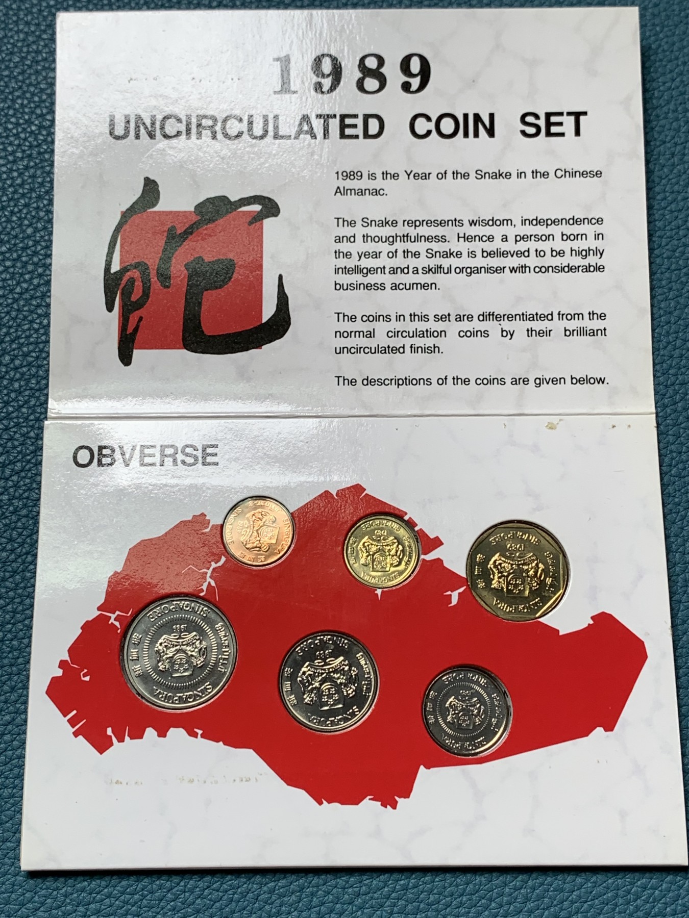 《竞宝斋》第190场-周日，周一 2场 (全场包邮) 新加坡1989年流通硬币6枚套蛇年生肖纪念卡册、新加坡马来西亚邮币册、马来亚和英属婆罗洲UNC品硬币4枚