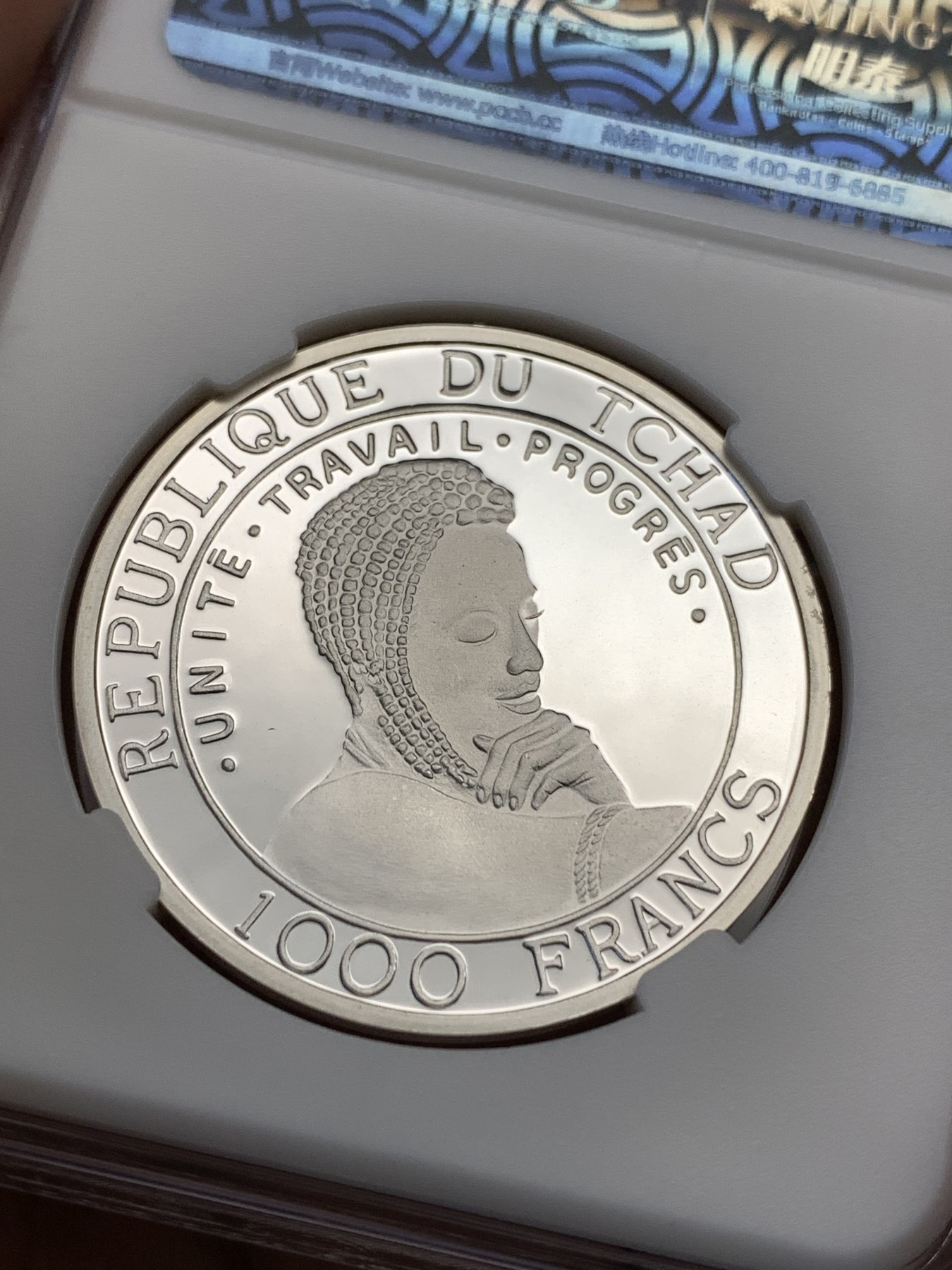 《竞宝斋》第190场-周日，周一 2场 (全场包邮) 乍得成吉思汗1000法郎纪念银币，重现古战场画面，背面美女等待英雄凯旋