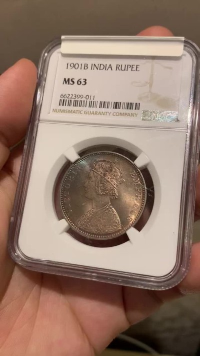 《竞宝斋》第190场-周日，周一 2场 (全场包邮) NGC MS63 高分 英属印度1901年维多利亚卢比银币 孔雀彩包浆超级漂亮