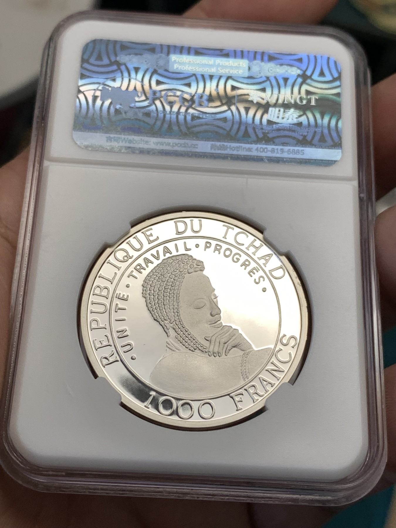 《竞宝斋》第190场-周日，周一 2场 (全场包邮) 乍得成吉思汗1000法郎纪念银币，重现古战场画面，背面美女等待英雄凯旋