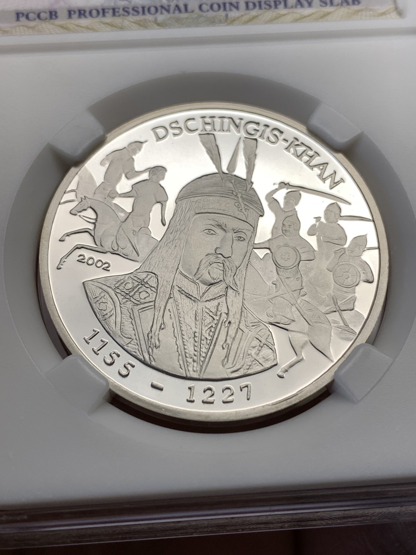 《竞宝斋》第190场-周日，周一 2场 (全场包邮) 乍得成吉思汗1000法郎纪念银币，重现古战场画面，背面美女等待英雄凯旋