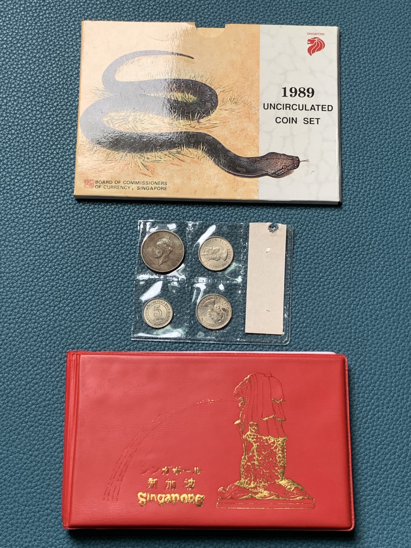 《竞宝斋》第190场-周日，周一 2场 (全场包邮) 新加坡1989年流通硬币6枚套蛇年生肖纪念卡册、新加坡马来西亚邮币册、马来亚和英属婆罗洲UNC品硬币4枚