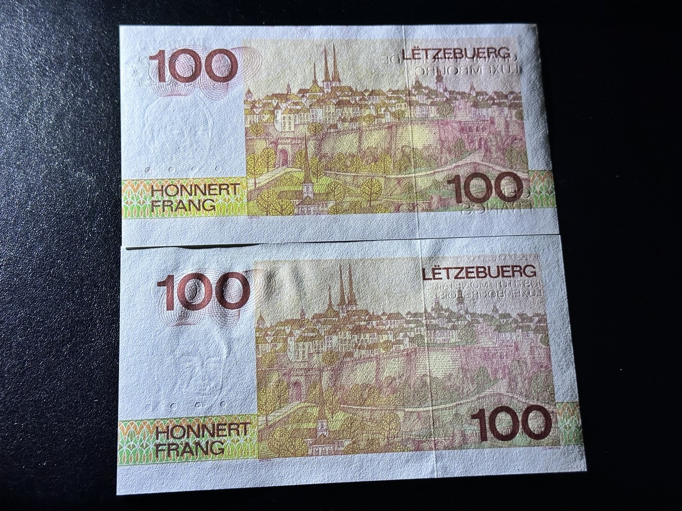 《外钞收藏家》第二百九十一期（荷兰比利时卢森堡欧元专场）（连拍第二场） 卢森堡80年代100法郎2枚不同，F999970接近关门号 全新UNC