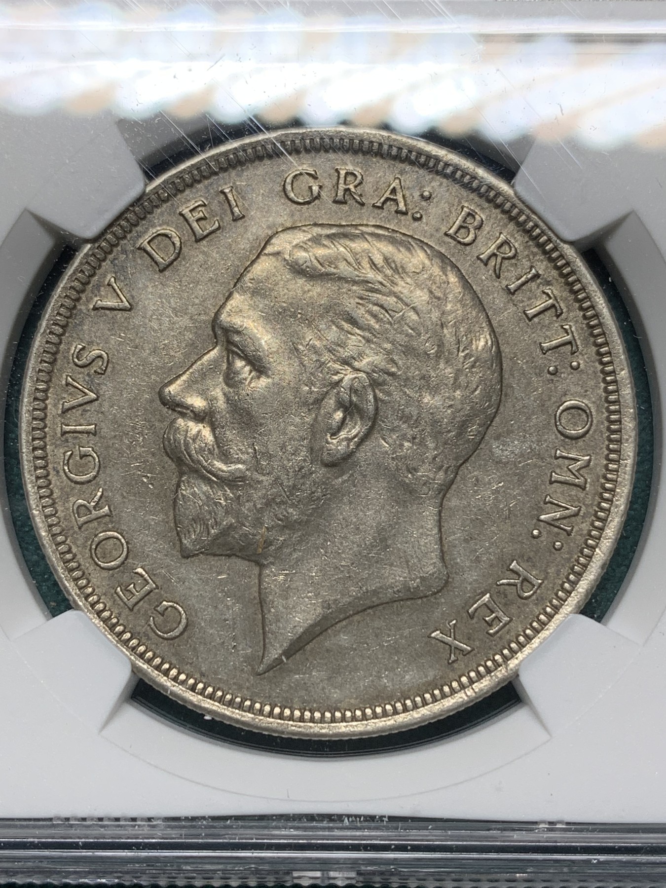 欢迎参加《竞宝斋》为爱冲冲冲 七夕特拍专场 ！第191场 (全场包邮) NGC-AU58 英国1929年乔治五世花冠1克朗银币 不同马剑系列 铸造数量稀少 仅4994枚 价格低地 老味道包浆