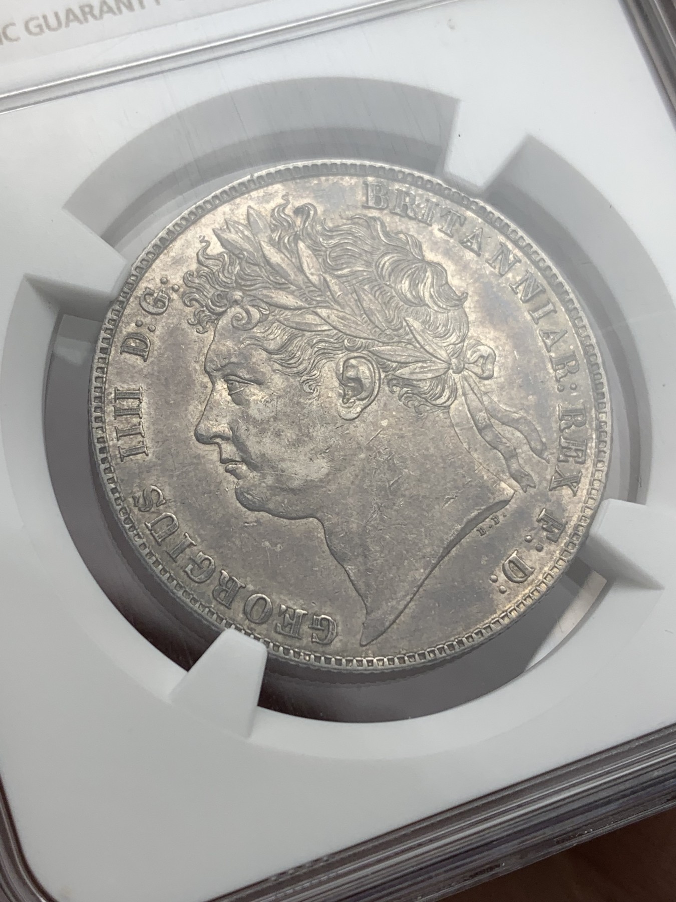 欢迎参加《竞宝斋》为爱冲冲冲 七夕特拍专场 ！第191场 (全场包邮) NGC AU58 英国 1823乔治四世盾徽半克朗银币，乔四三花半克朗随处可见，盾徽版任何品相都十分稀缺