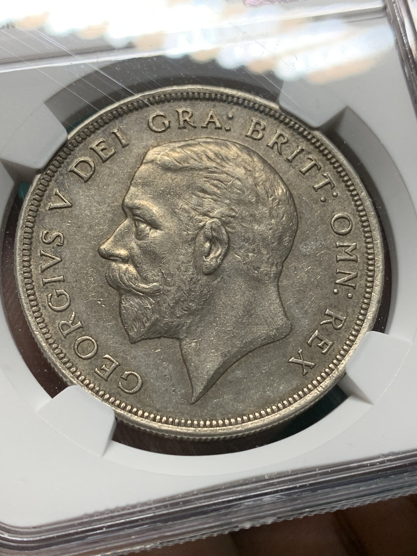 欢迎参加《竞宝斋》为爱冲冲冲 七夕特拍专场 ！第191场 (全场包邮) NGC-AU58 英国1929年乔治五世花冠1克朗银币 不同马剑系列 铸造数量稀少 仅4994枚 价格低地 老味道包浆