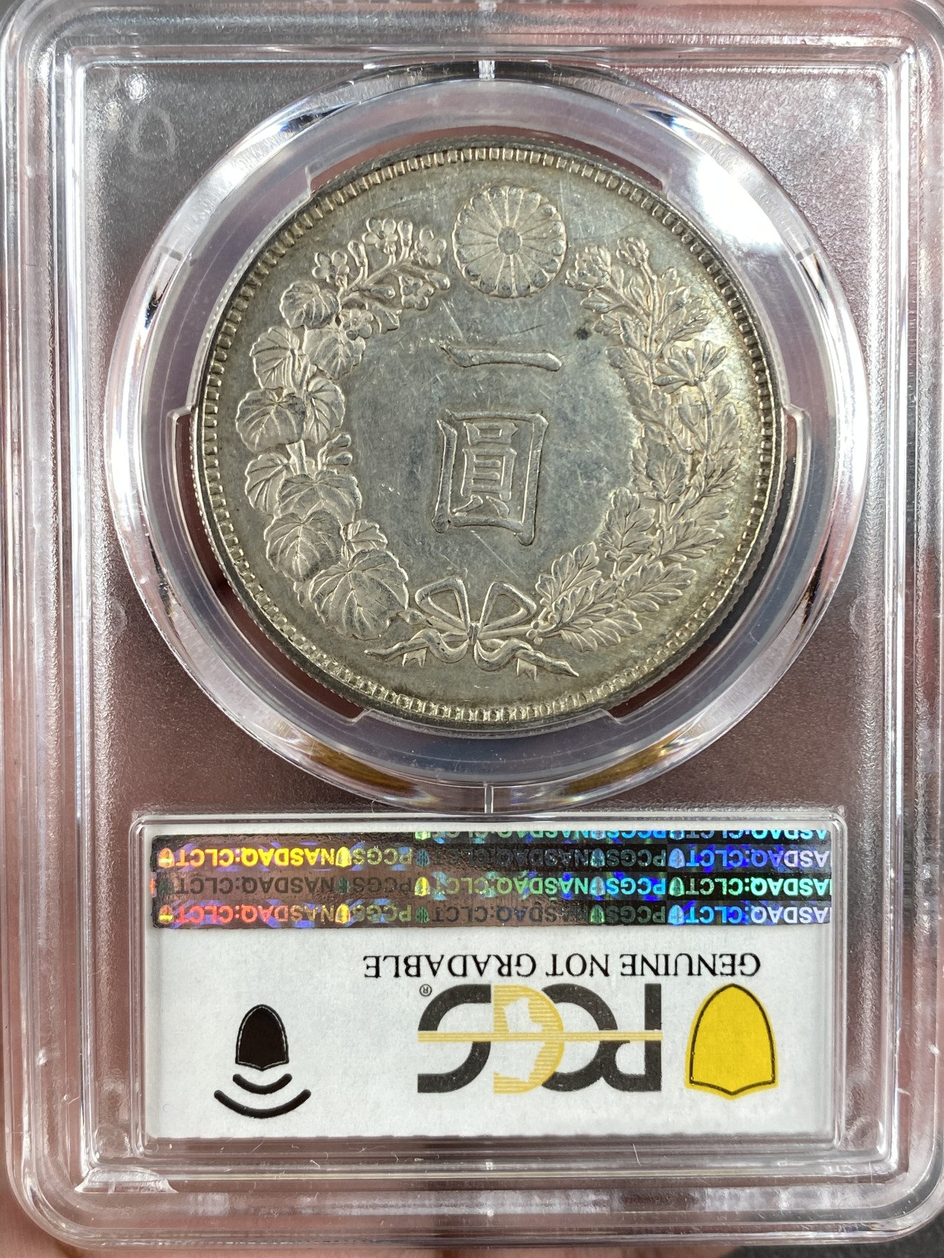 万国钱币拍卖第014期（奢华币宴第一季） PCGS UNCD 1886年日本明治十九年后期小型特年龙洋1元，稀缺程度同明治七年，极少的版别，同版的AU55分19年ha成交价4800美金。