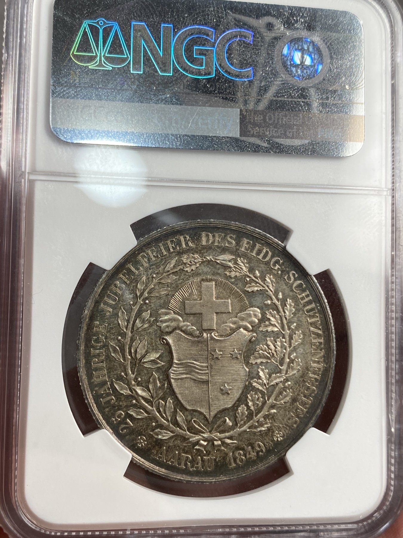 万国钱币拍卖第014期（奢华币宴第一季） NGC MS64 1849瑞士阿尔高射击节银章 高分镜面五彩难得