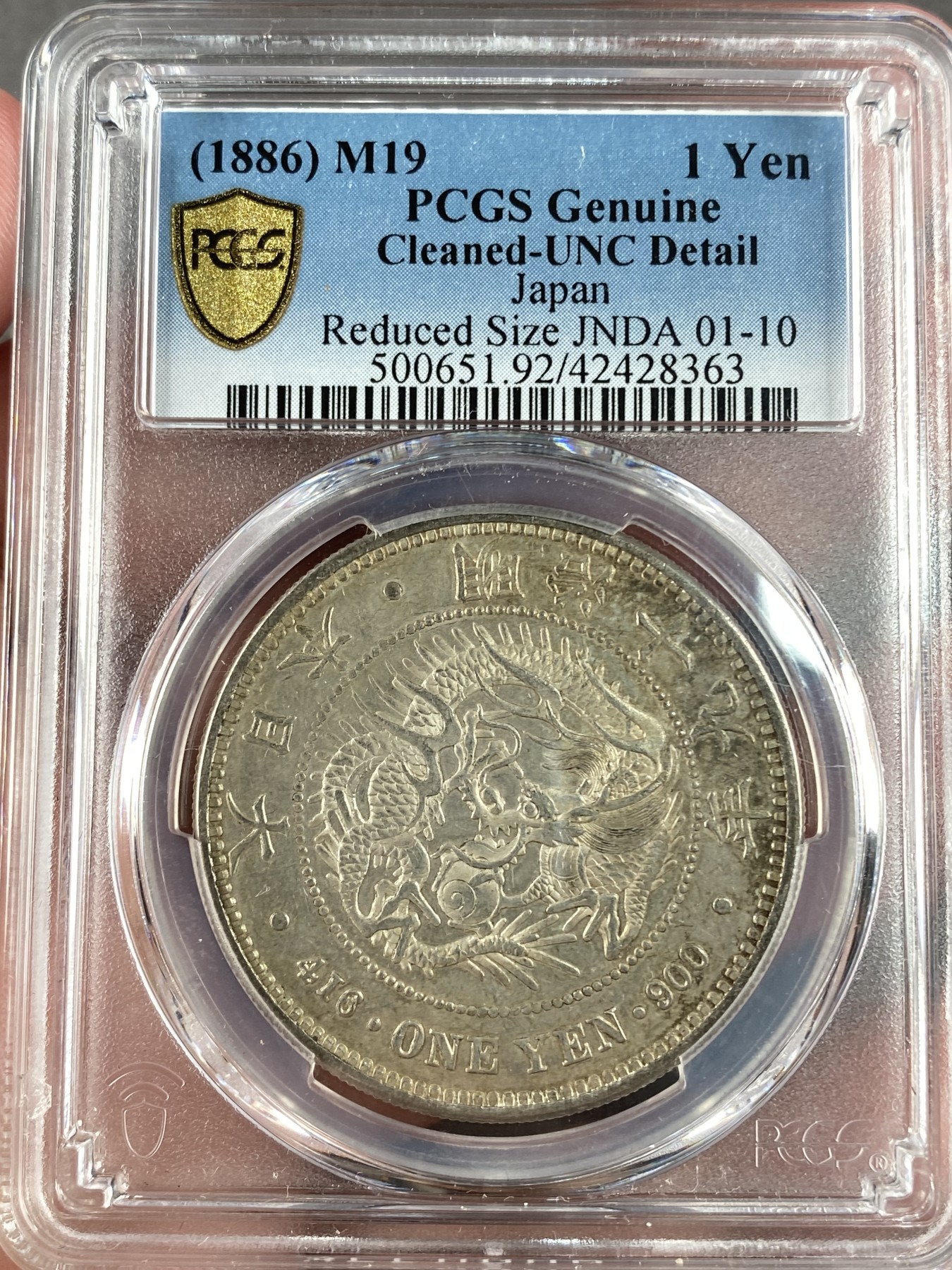 万国钱币拍卖第014期（奢华币宴第一季） PCGS UNCD 1886年日本明治十九年后期小型特年龙洋1元，稀缺程度同明治七年，极少的版别，同版的AU55分19年ha成交价4800美金。
