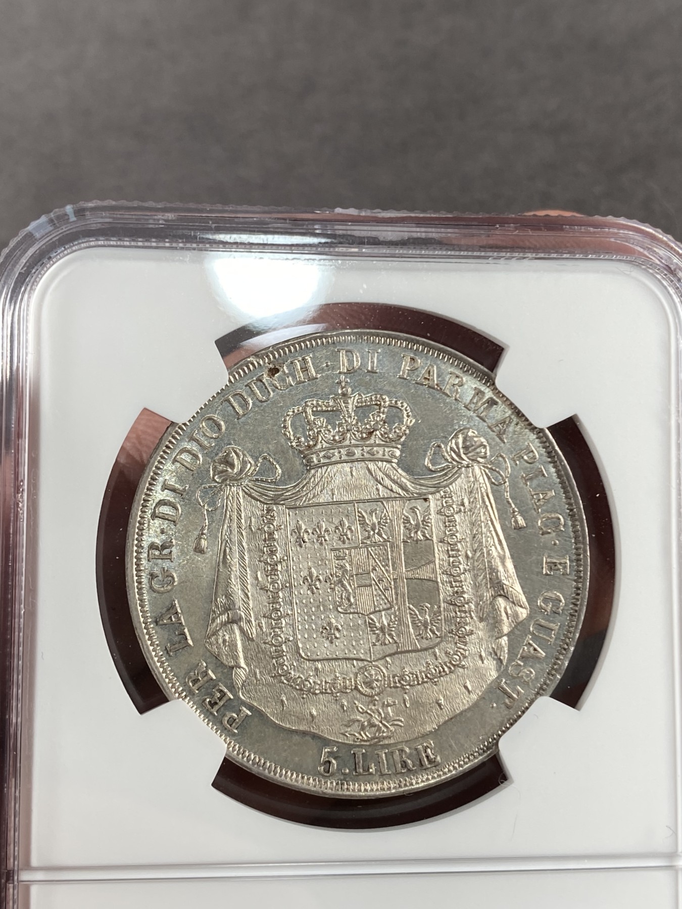 万国钱币拍卖第014期（奢华币宴第一季） NGC MS62 意大利1815年帕尔马5里拉，正面肖像为帕尔马女大公拿破仑夫人玛利亚露易斯，背面为帕尔马公国繁复华丽的纹章，类镜面质感，非常美丽。