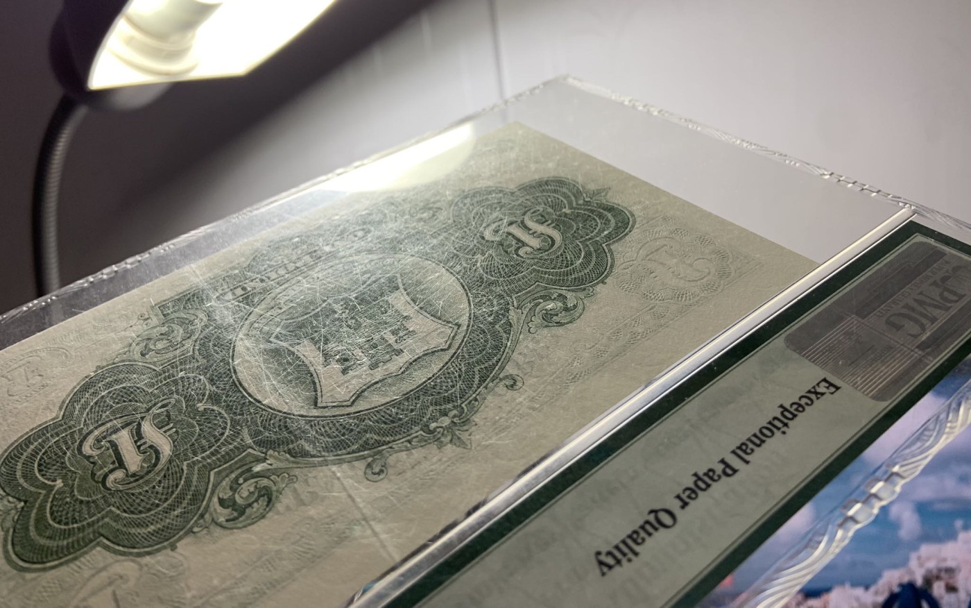 收藏联盟Quantum Auction 第283期拍卖  直布罗陀1971年1镑 PMG65 号码无47 壳子有摩擦