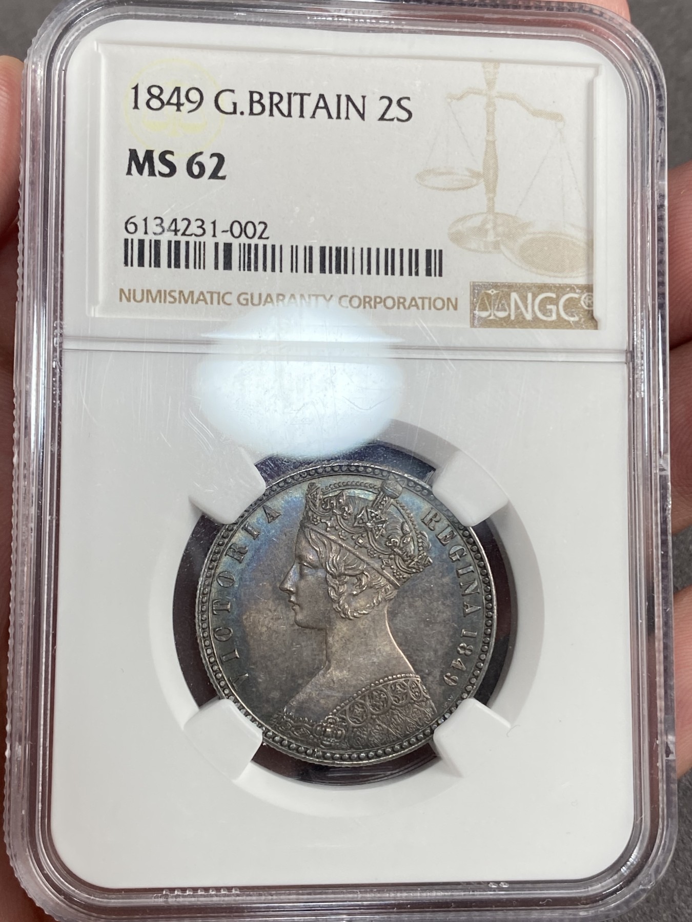 万国钱币拍卖第014期（奢华币宴第一季） NGC MS62 英国1849年维多利亚无神弗洛林，小名誉品种，双面五彩，最难得的是背面全深打非常漂亮，真正的百里挑一。