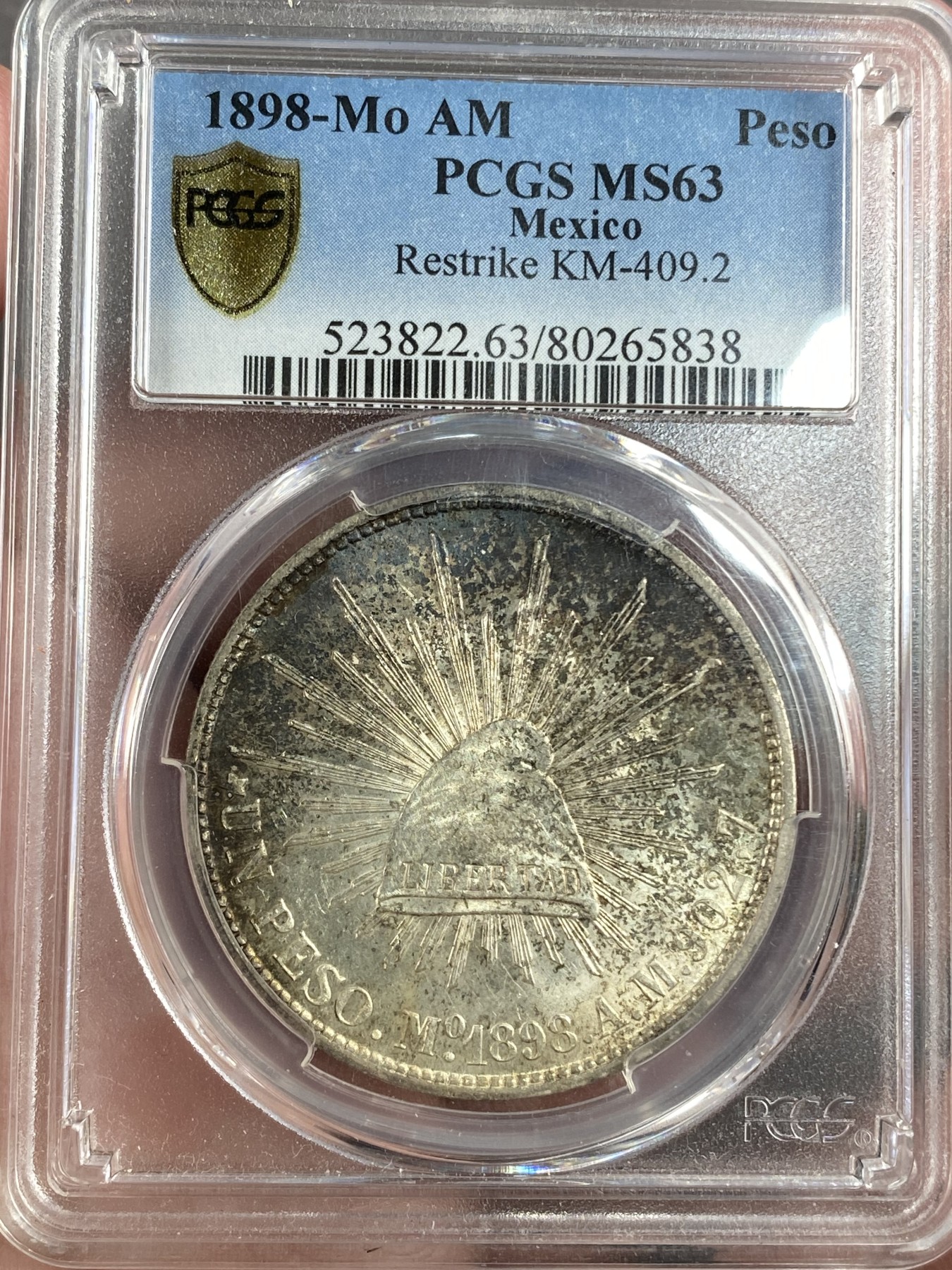 万国钱币拍卖第014期（奢华币宴第一季） PCGS MS63 1898年墨西哥mo厂特供民国后铸版 亮眼的酱彩如同崭新的品相令人心动