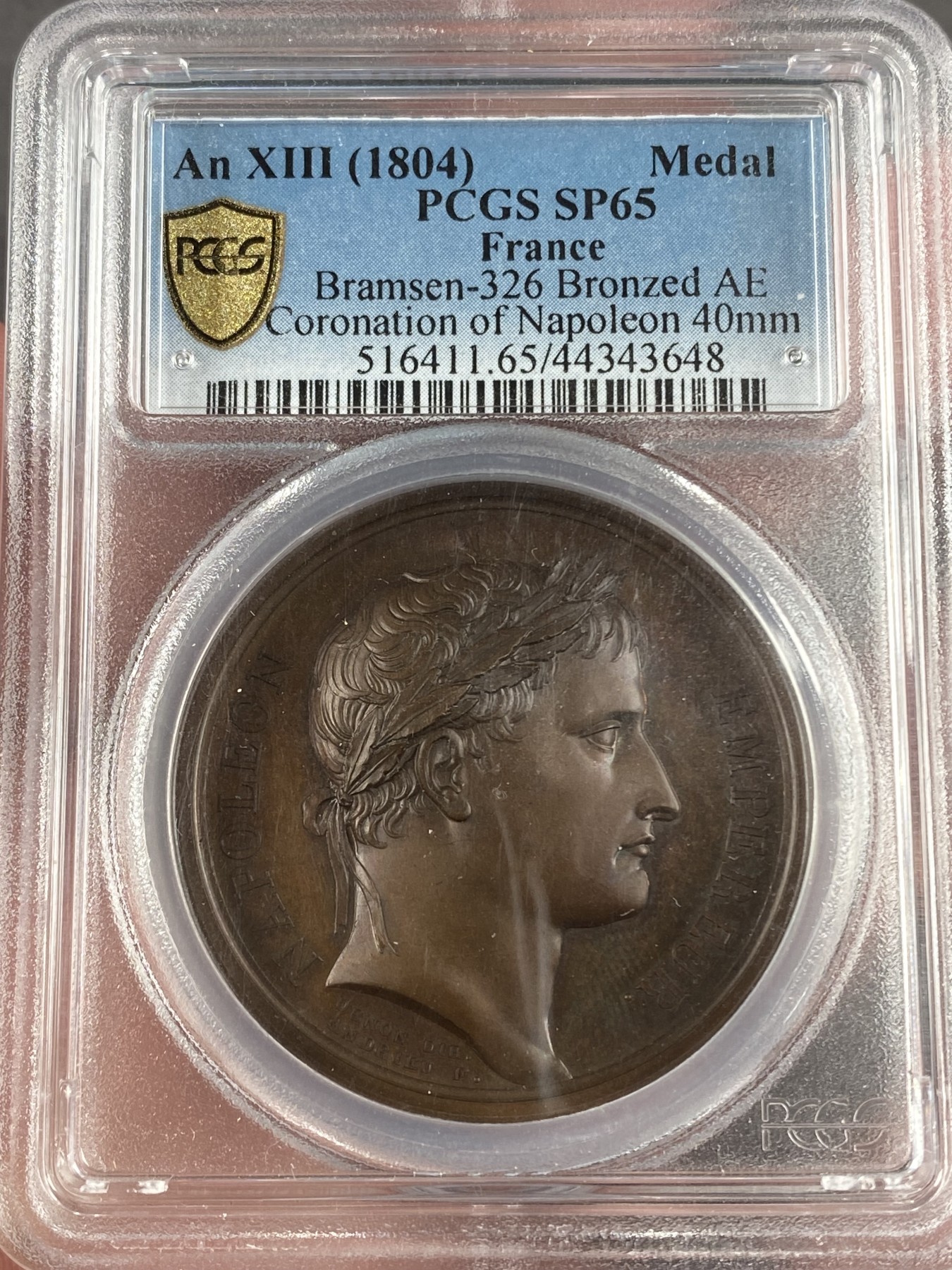 万国钱币拍卖第014期（奢华币宴第一季） PCGS SP65 1804拿破仑登基纪念铜章。PCGS唯一冠军，封面广告章，五彩底板，极品状态。