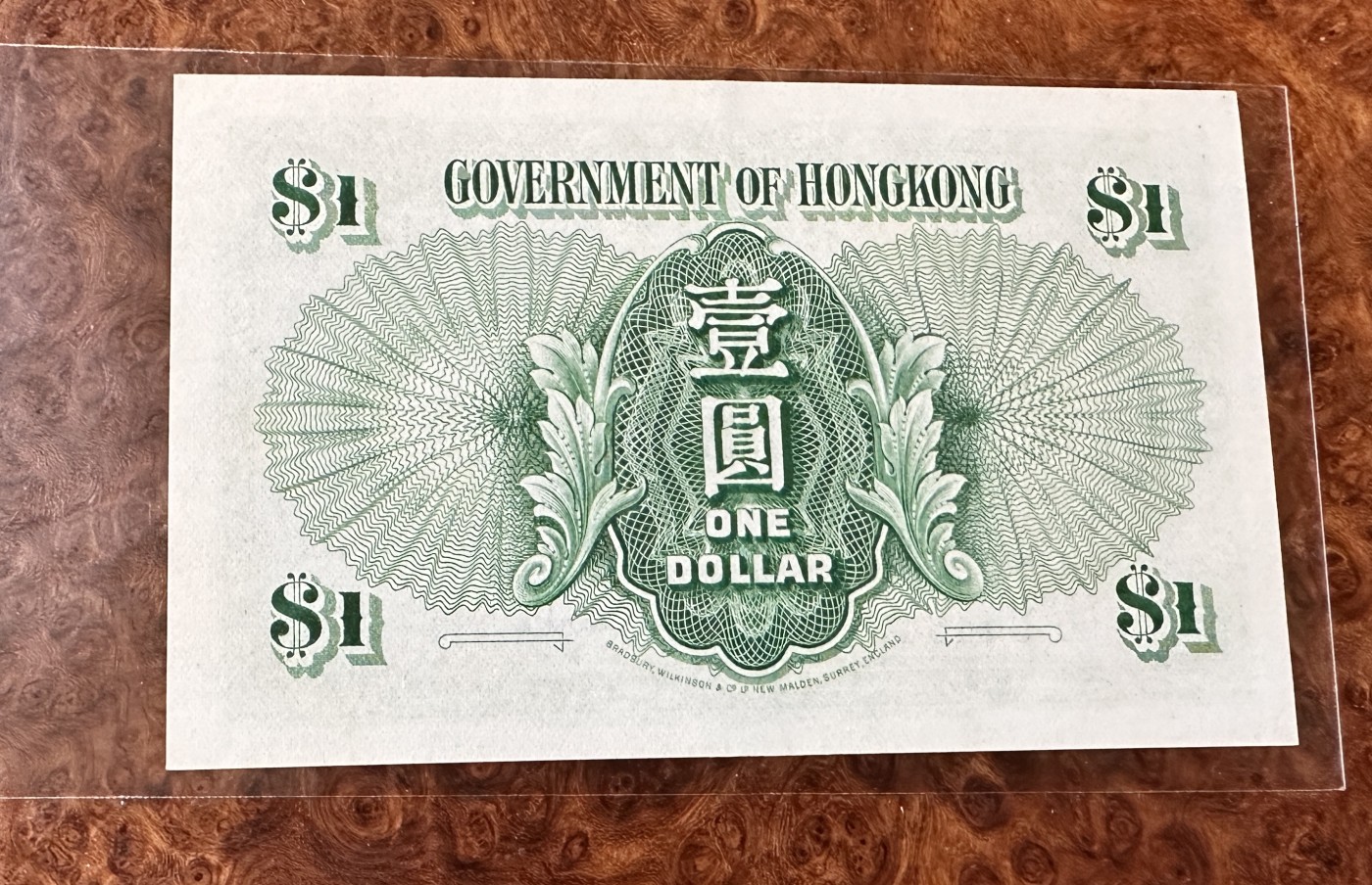 Chase Auction 第24期 - - 外钞、民国钞和人民币混合场！ 香港早期1元，大冠女王，品相如图，UNC-！