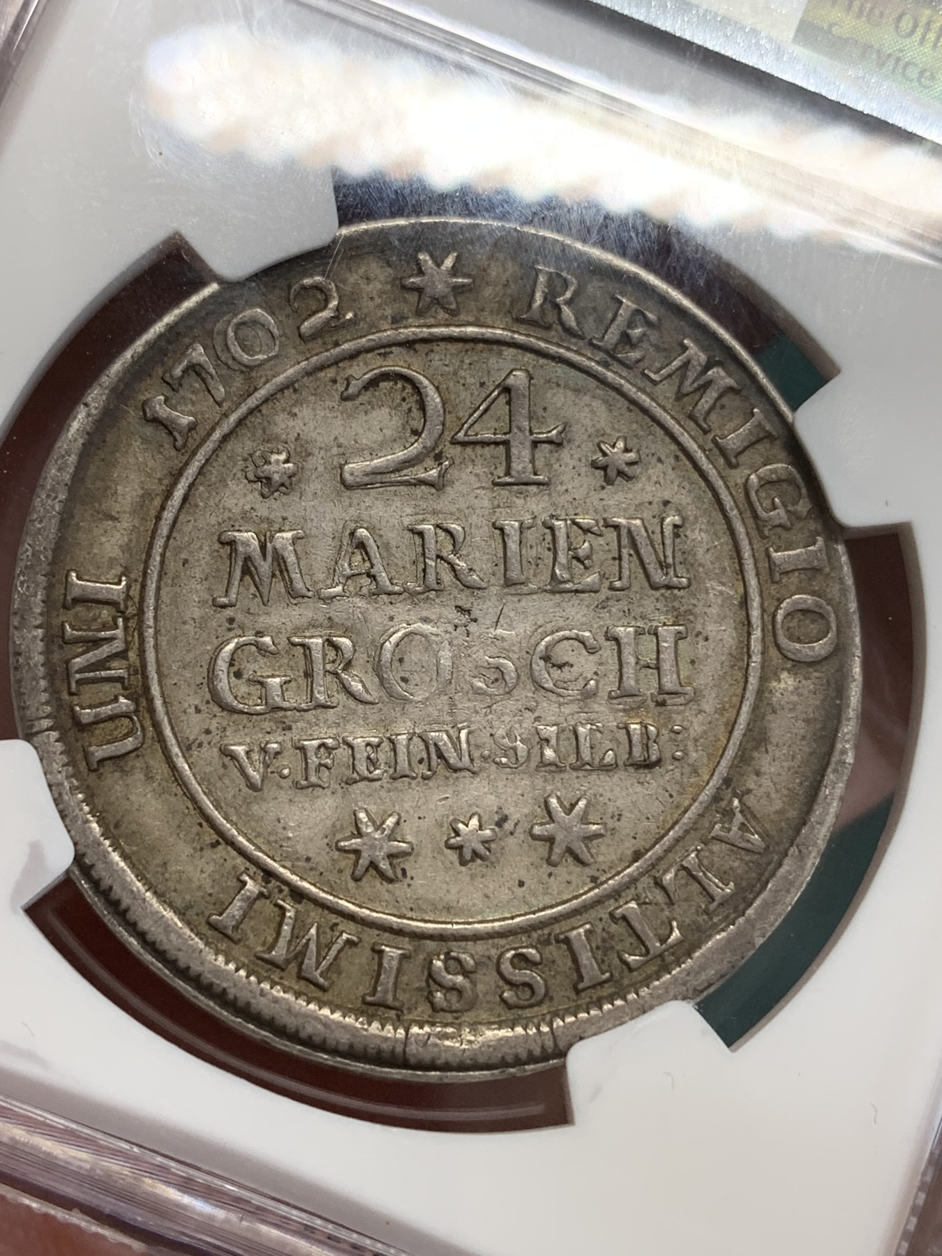 《竞宝斋》第192场-周日，周一 2场 (全场包邮) NGC XF45（第5名）德国不伦瑞克1702年野人24M(2/3泰勒)300多年的银币 眉目清晰 色泽均匀。