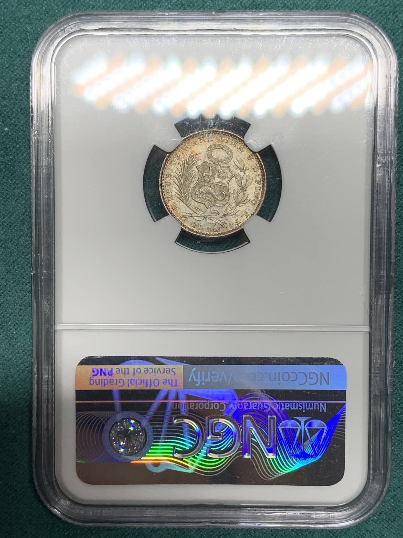 《竞宝斋》第192场-周日，周一 2场 (全场包邮) NGC-MS65 1906年秘鲁1第纳尔坐人女神银币，少见面值，彩浆顶级状态。国内常见为1/2第纳尔，1第纳尔首见。65收藏级高分。