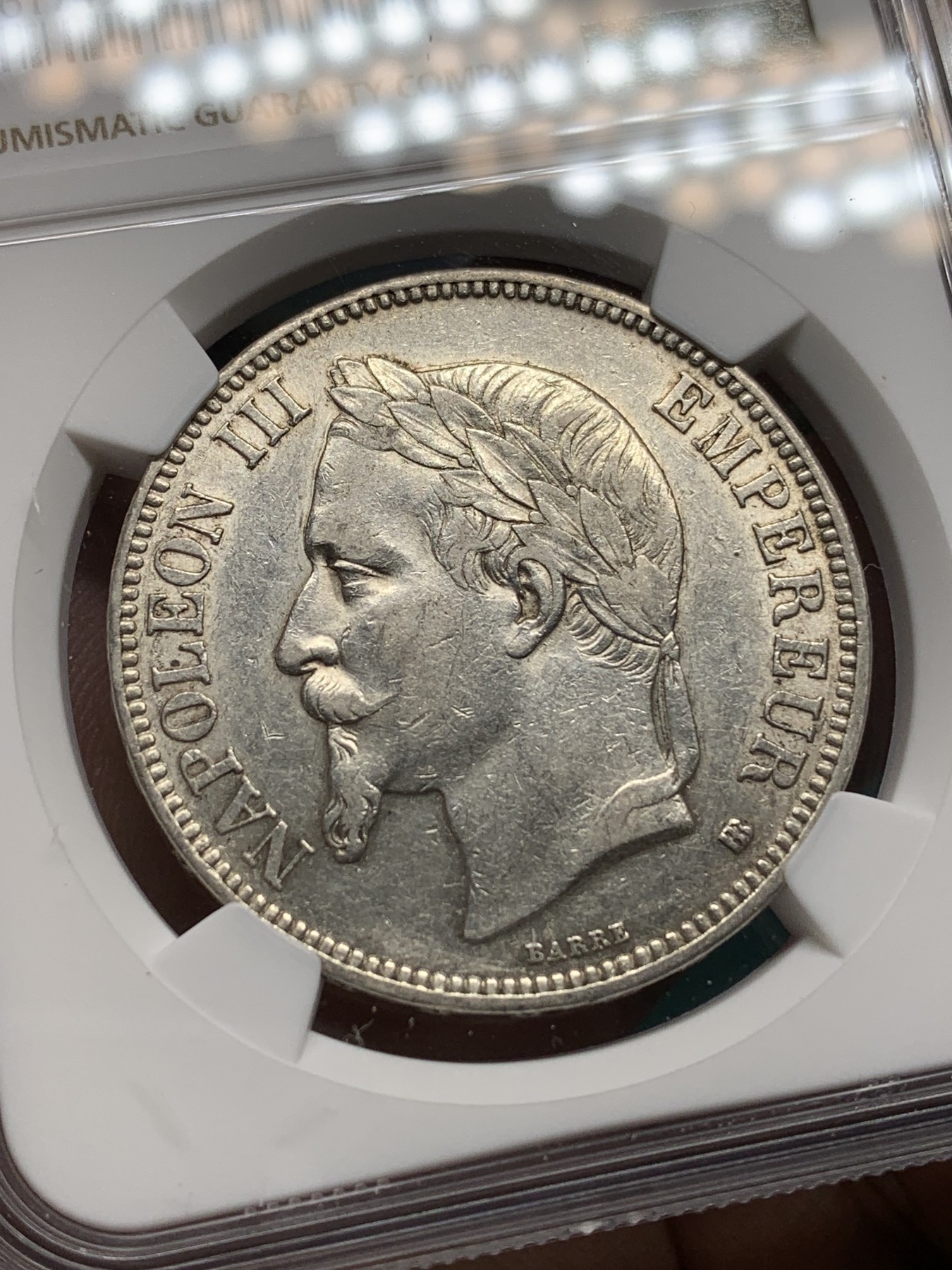 《竞宝斋》第192场-周日，周一 2场 (全场包邮) NGC AU50 法国 1869年BB版拿三5法郎银币 带底光 非常好