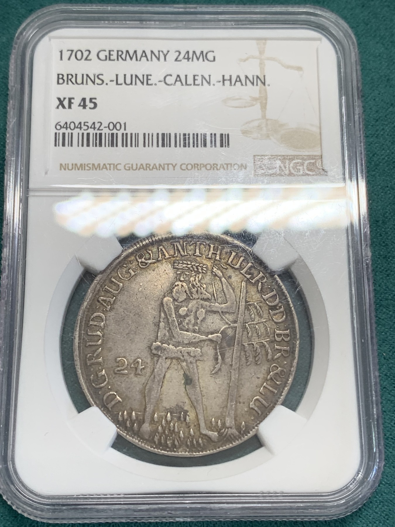 《竞宝斋》第192场-周日，周一 2场 (全场包邮) NGC XF45（第5名）德国不伦瑞克1702年野人24M(2/3泰勒)300多年的银币 眉目清晰 色泽均匀。