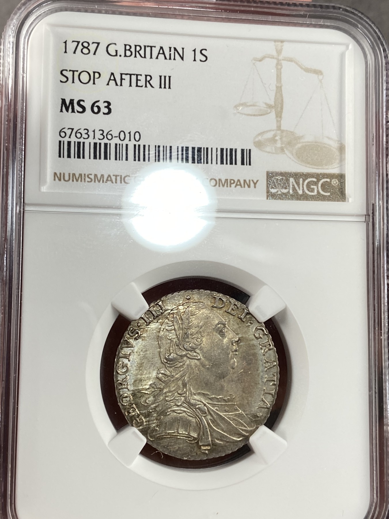 万国钱币拍卖第015期（奢华币章第二季） NGC MS63 1787年英国乔治三世1先令 丝绸般的底板表明它是从一对高度抛光的模具中压制出来的 这些压印在乔三的脸颊和皇冠上闪闪发光