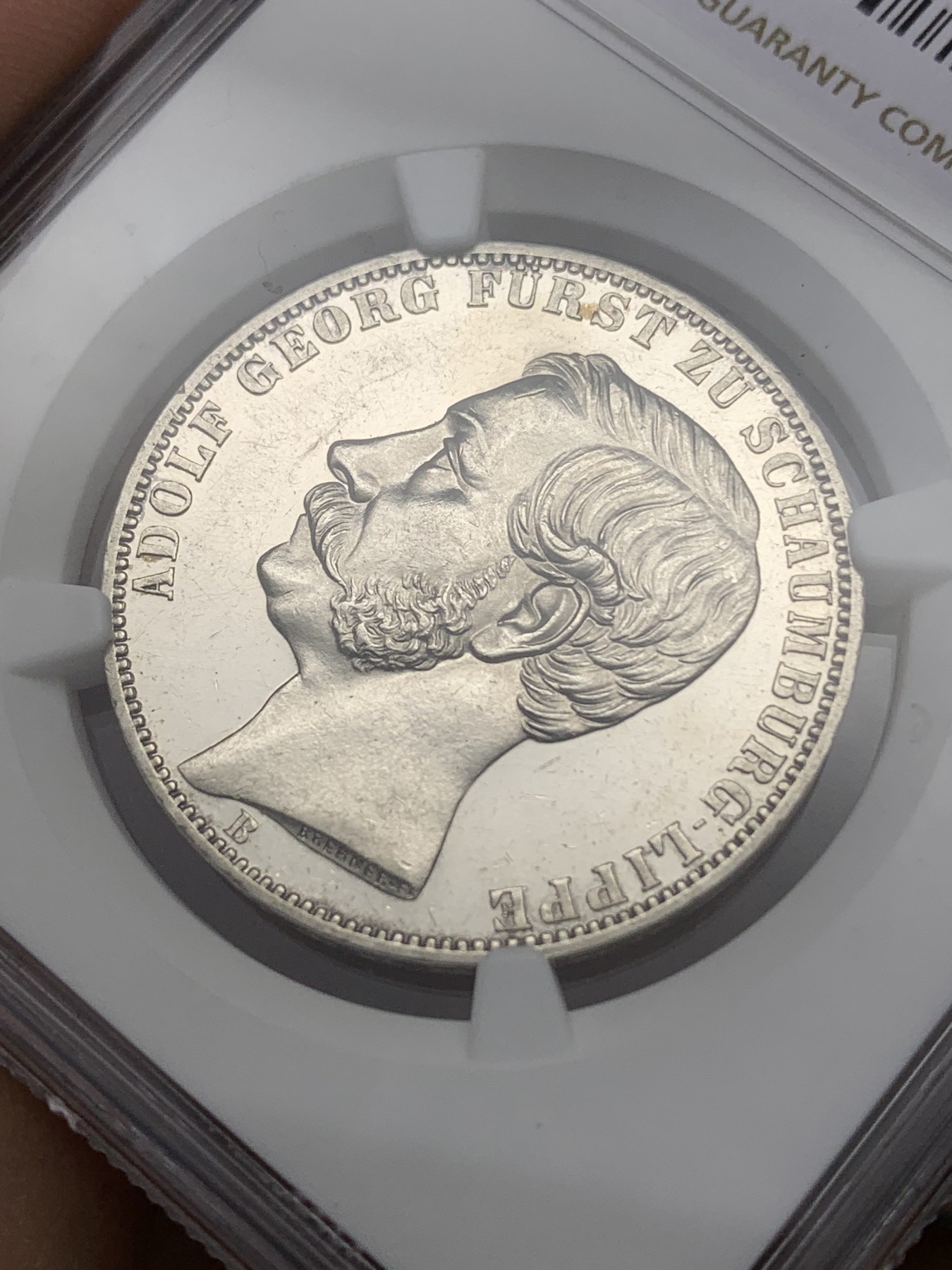 《竞宝斋》第193场-周日，周一 2场 (全场包邮) NGC-UNC 1865年德国绍姆堡利普天使1泰勒银币（发行7000枚的德系小珍）状态好 可以养养包浆试试