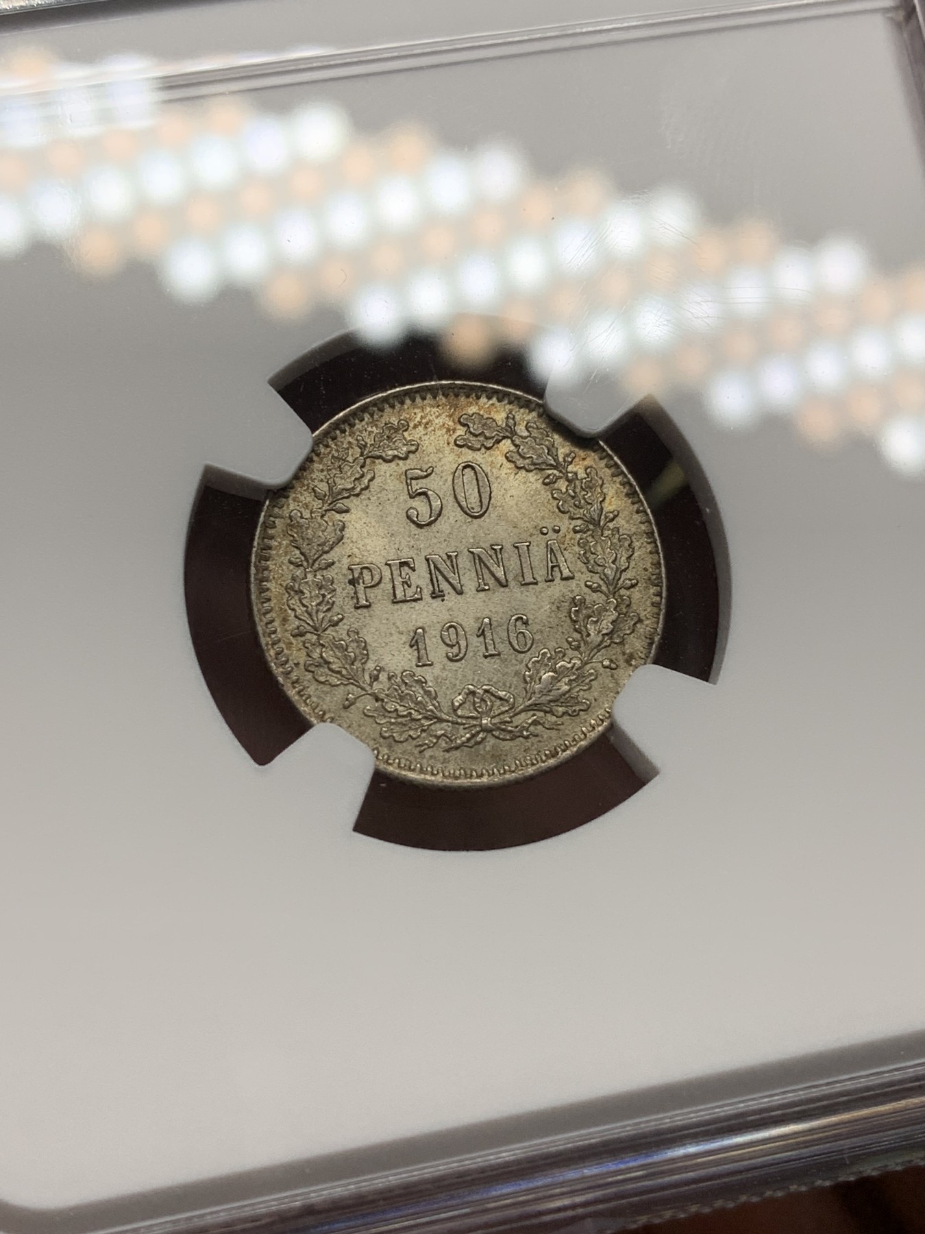 《竞宝斋》第193场-周日，周一 2场 (全场包邮) NGC MS63、MS64 俄占芬兰1916年25、50盆尼小银币一对，25盆尼是金色彩包浆，50芬尼略带淡金包浆，都非常漂亮
